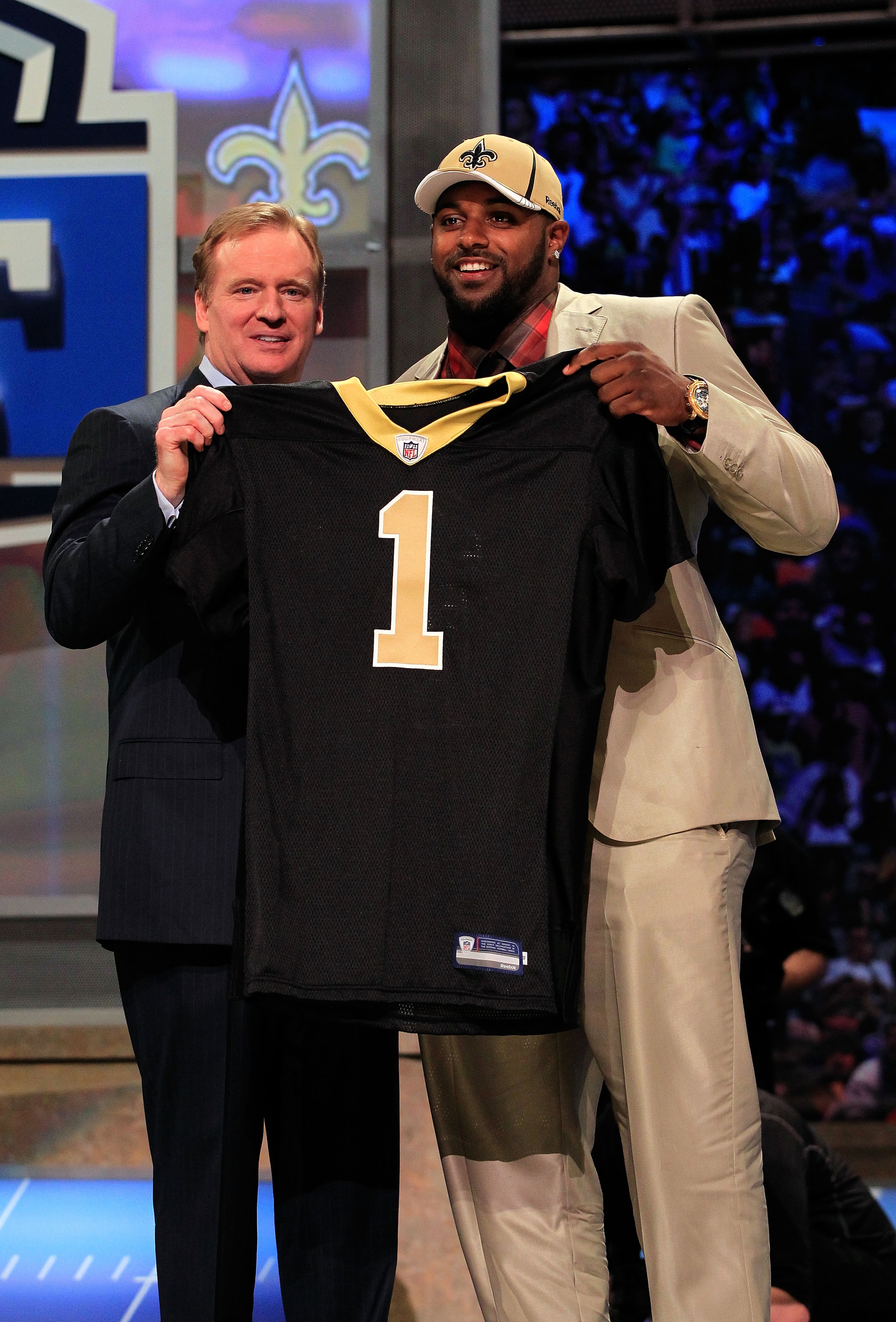NEW YORK, NY - APRIL 28:  NFL Commissioner Roger Goodell (L) poses for a photo with Cameron Jordan, #24 overall pick by the New Orleans Saints, holds up a jersey on stage during the 2011 NFL Draft at Radio City Music Hall on April 28, 2011 in New York Cit