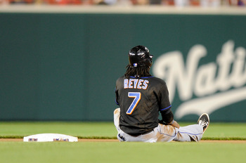 WASHINGTON, DC - APRIL 28:  Jose Reyes #7 of the New York Mets sits in the infield after being thrown out trying to steal second base to end the seventh inning against the Washington Nationals at Nationals Park on April 28, 2011 in Washington, DC. The Nat