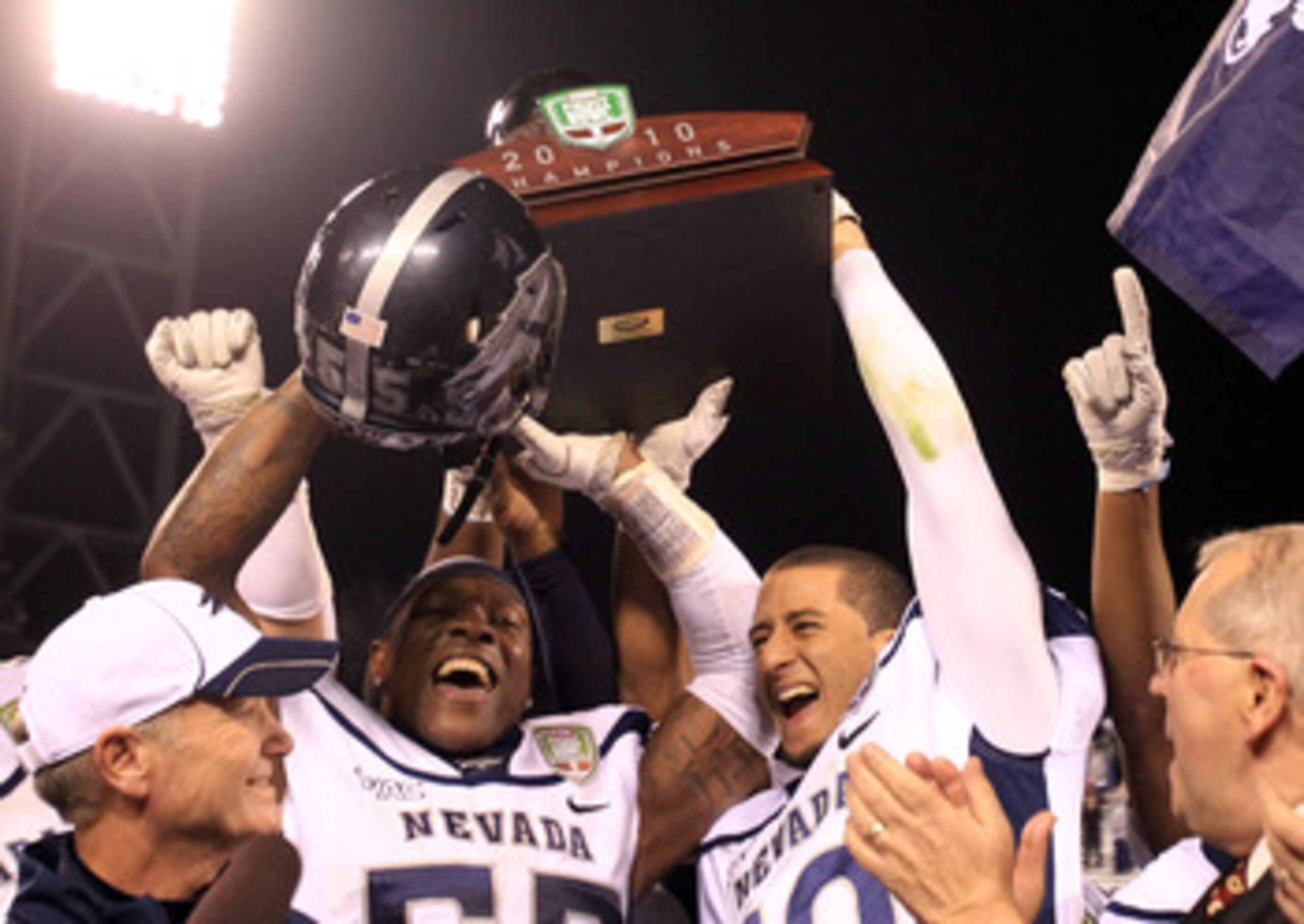 SAN FRANCISCO, CA - JANUARY 09:  Dontay Moch #55 and Colin Kaepernick #10 of the Nevada Wolf Pack hold up the trophy after they beat Boston College in the Kraft Fight Hunger Bowl at AT&T Park on January 9, 2011 in San Francisco, California.  (Photo by Ezr