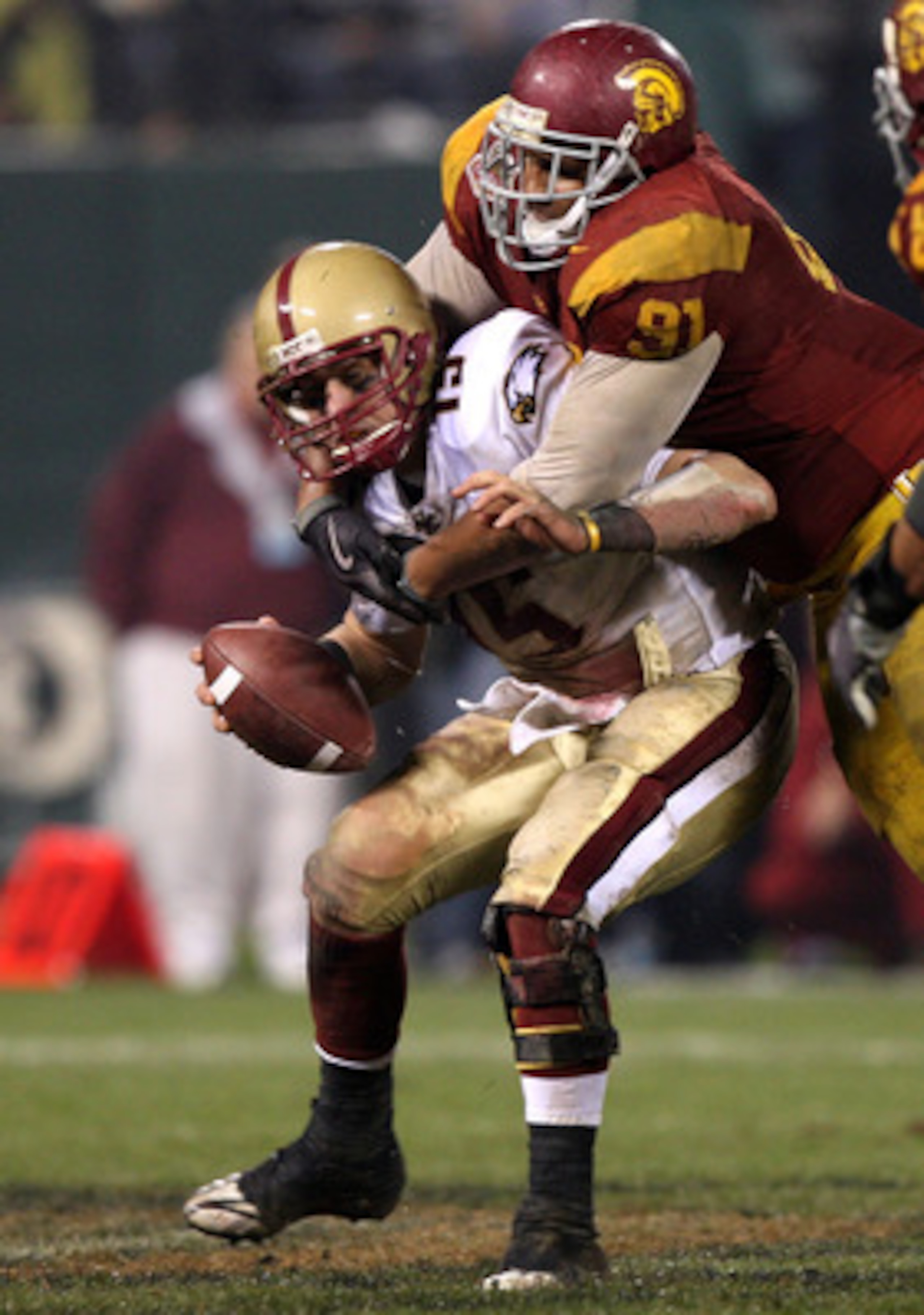 SAN FRANCISCO - DECEMBER 26: Dave Shinskie #15 of the Boston College Eagles is sacked by Jurrell Casey #91 of the USC Trojans during the 2009 Emerald Bowl at AT&T Park on December 26, 2009 in San Francisco, California. (Photo by Jed Jacobsohn/Getty Images