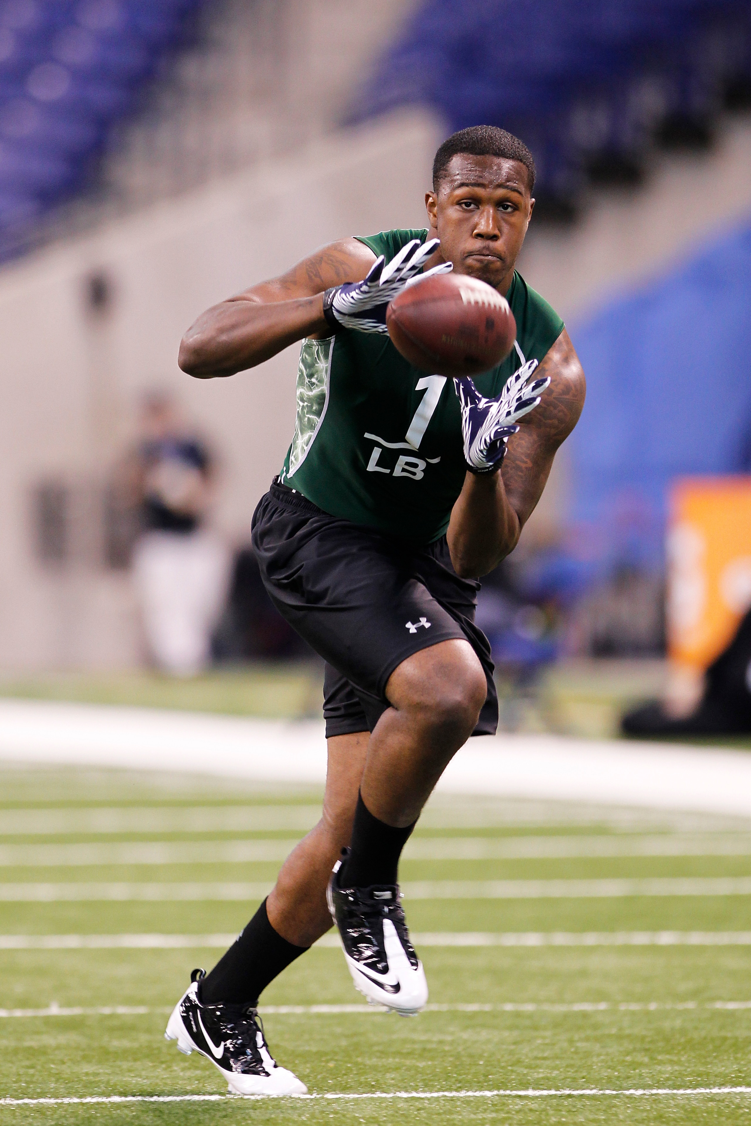 INDIANAPOLIS, IN - FEBRUARY 28: Akeem Ayers of UCLA works out during the 2011 NFL Scouting Combine at Lucas Oil Stadium on February 28, 2011 in Indianapolis, Indiana. (Photo by Joe Robbins/Getty Images) INDIANAPOLIS, IN - FEBRUARY 28: Akeem Ayers of UCLA works out during the 2011 NFL Scouting Combine at Lucas Oil Stadium on February 28, 2011 in Indianapolis, Indiana. (Photo by Joe Robbins/Getty Images)