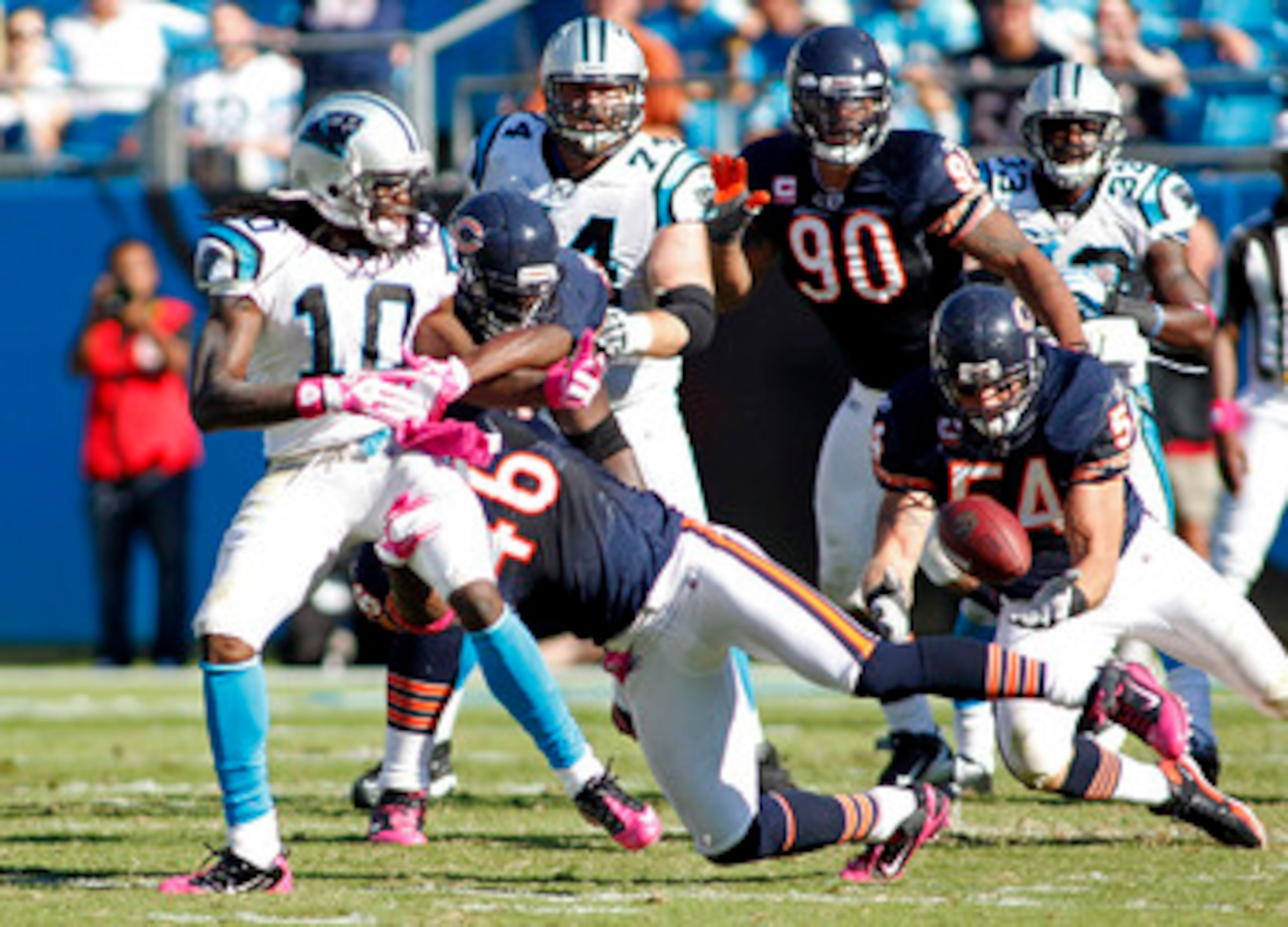 CHARLOTTE, NC - OCTOBER 10: Linebacker Brian Urlacher #54 of the Chicago Bears intercepts a pass intended for wide receiver Armanti Edwards #10 of the Carolina Panthers at Bank of America Stadium on October 10, 2010 in Charlotte, North Carolina. (Photo by