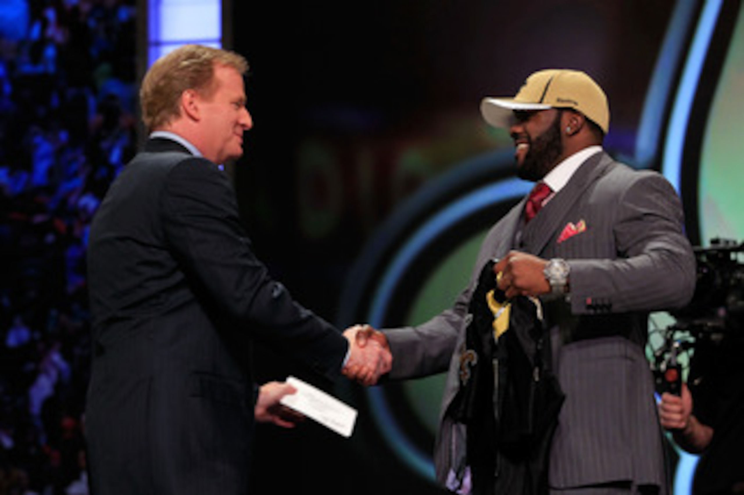 NEW YORK, NY - APRIL 28:  NFL Commissioner Roger Goodell (L) greets Mark Ingram, #28 overall pick by the New Orleans Saints, on stage during the 2011 NFL Draft at Radio City Music Hall on April 28, 2011 in New York City.  (Photo by Chris Trotman/Getty Ima