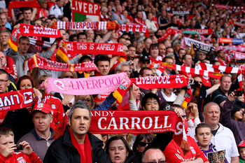 LIVERPOOL, ENGLAND - APRIL 23:  Liverpool fans show their support prior to the Barclays Premier League match between Liverpool and Birmingham City at Anfield on April 23, 2011 in Liverpool, England.  (Photo by Clive Brunskill/Getty Images)