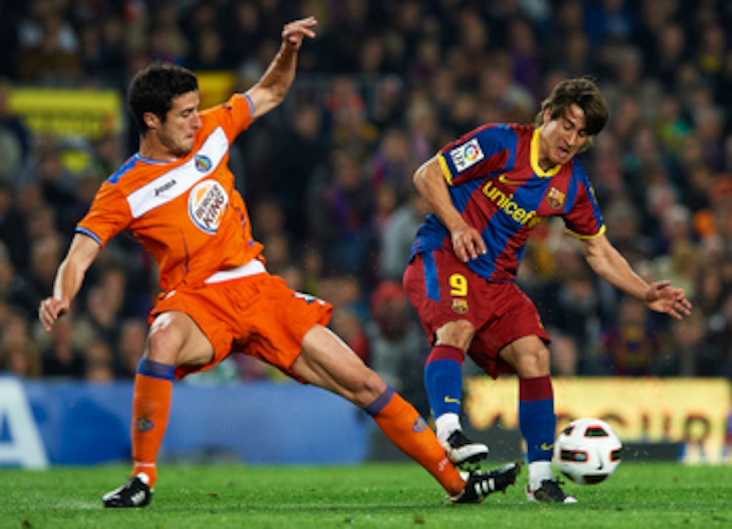 BARCELONA, SPAIN - MARCH 19:  Ivan Marcano of Getafe is tacked by Bojan Krkic (R) of Barcelona during the La Liga match between Barcelona and Getafe at Camp Nou on March 19, 2011 in Barcelona, Spain.  (Photo by Manuel Queimadelos Alonso/Getty Images)
