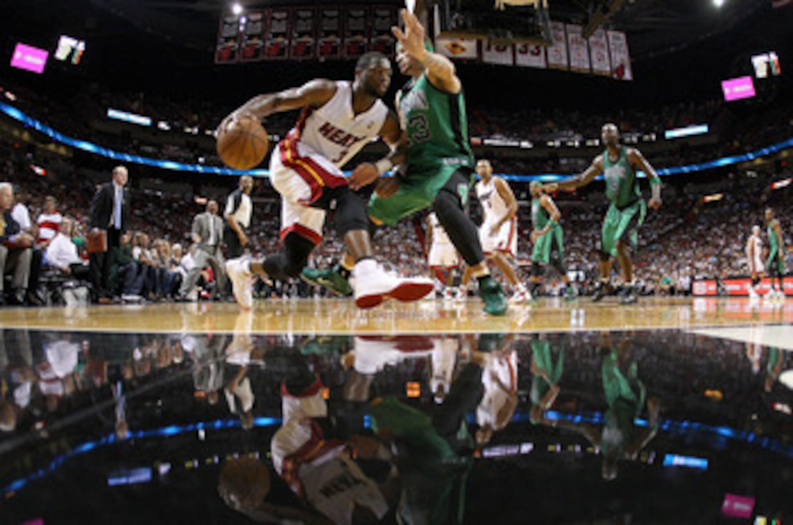 MIAMI, FL - APRIL 10: Dwyane Wade #3 of the Miami Heat drives on Delonte West #13 of the Boston Celtics during a game at American Airlines Arena on April 10, 2011 in Miami, Florida. NOTE TO USER: User expressly acknowledges and agrees that, by downloadi MIAMI, FL - APRIL 10: Dwyane Wade #3 of the Miami Heat drives on Delonte West #13 of the Boston Celtics during a game at American Airlines Arena on April 10, 2011 in Miami, Florida. NOTE TO USER: User expressly acknowledges and agrees that, by downloadi