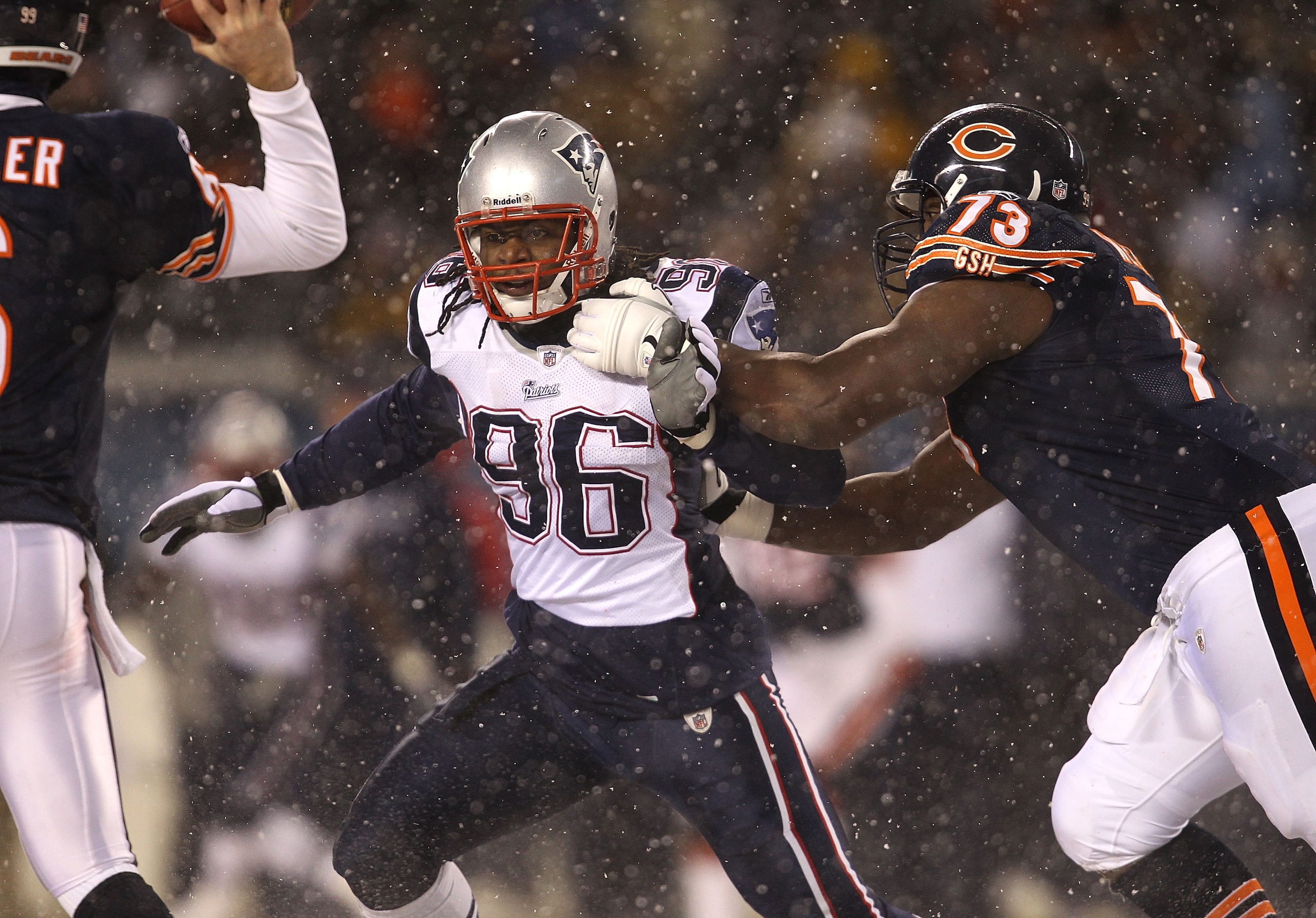 CHICAGO, IL - DECEMBER 12: Jermaine Cunningham #96 of the New England Patriots rushes past J'Marcus Webb #73 of the Chicago Bears towards Jay Cutler #6 at Soldier Field on December 12, 2010 in Chicago, Illinois. The Patriots defeated the Bears 36-7. (Phot