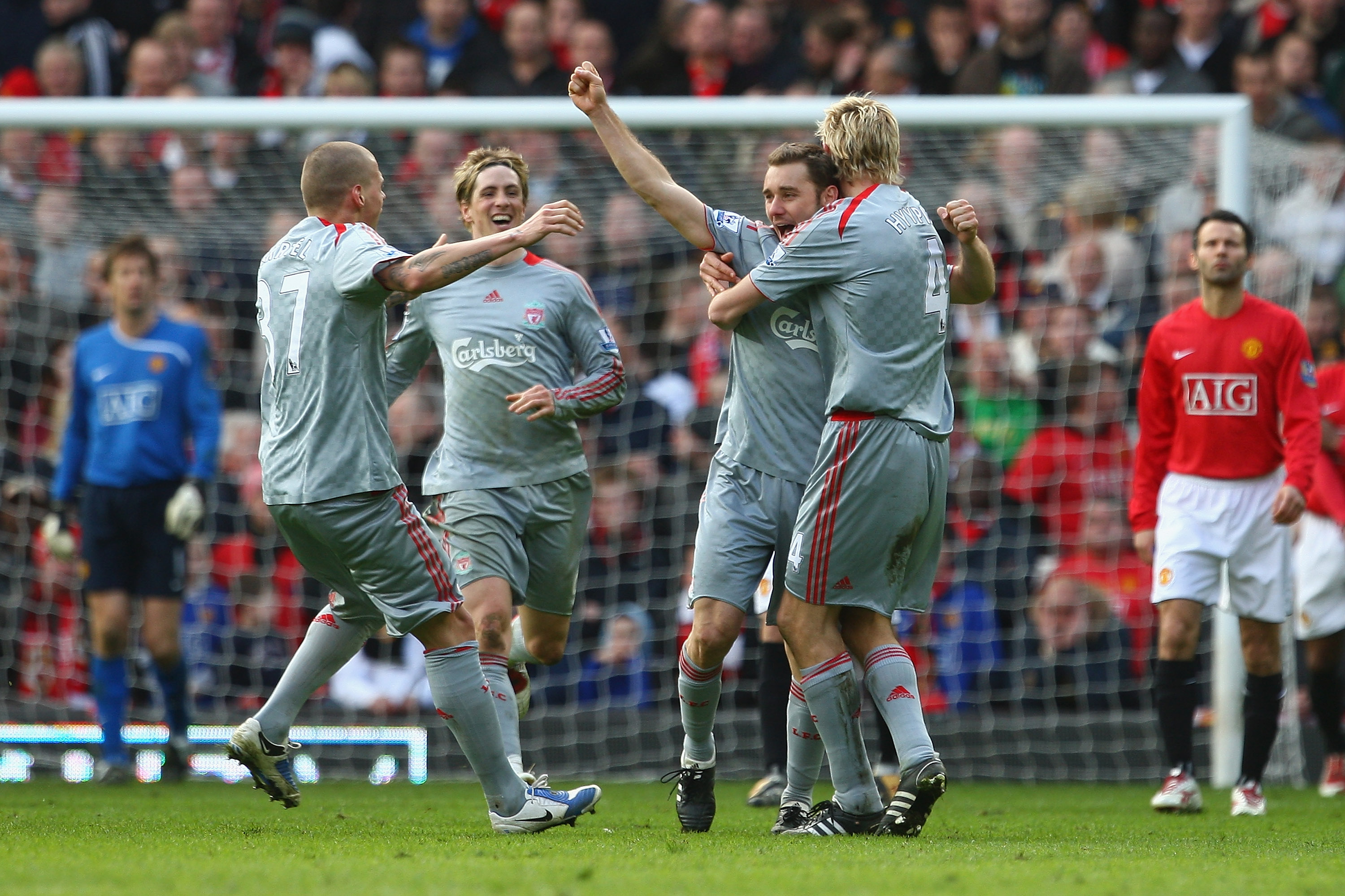 MANCHESTER, UNITED KINGDOM - MARCH 14:  Fabio Aurelio of Liverpool celebrates scoring his team's third goal with his team mates during the Barclays Premier League match between Manchester United and Liverpool at Old Trafford on March 14, 2009 in Mancheste