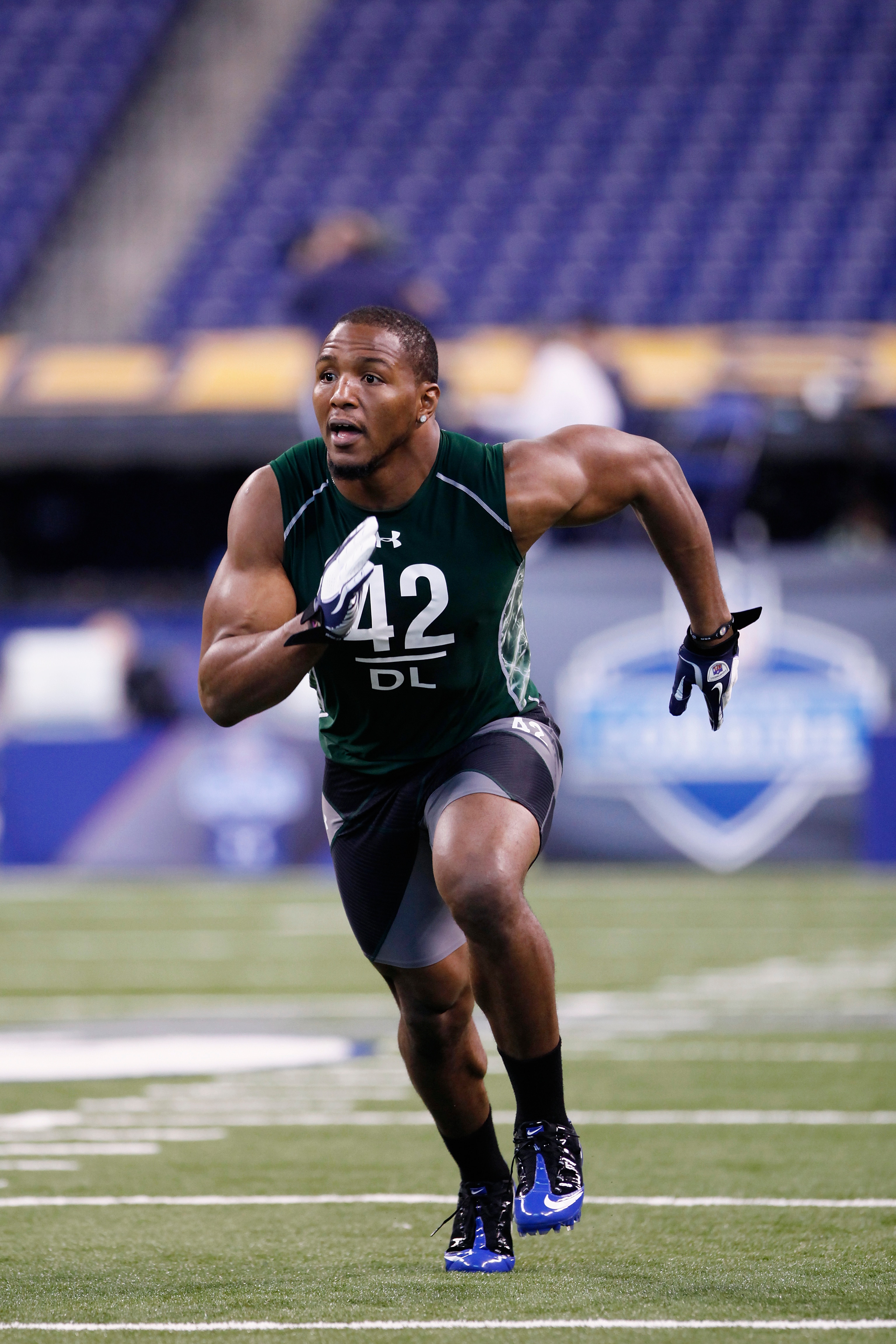 INDIANAPOLIS, IN - FEBRUARY 28: Defensive lineman Robert Quinn of North Carolina runs through a drill during the 2011 NFL Scouting Combine at Lucas Oil Stadium on February 28, 2011 in Indianapolis, Indiana. (Photo by Joe Robbins/Getty Images)