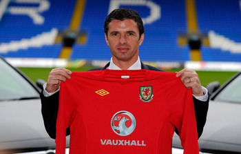 CARDIFF, WALES - JANUARY 12:  Wales manager Gary Speed holds up the team shirt at the launch of the announcment of Vauxhall as the new team sponsor at Cardiff City Stadium on January 12, 2011 in Cardiff, Wales.  (Photo by Stu Forster/Getty Images)