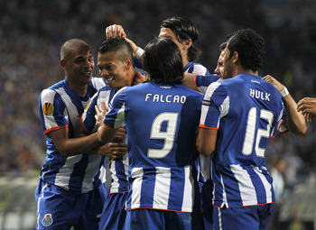 PORTO, PORTUGAL - APRIL 28:  Fredy Guarin (2nd L) of FC Porto celebrates with team mates after scoring his side second goal during the UEFA Europa League semi final first leg match between FC Porto and Villarreal at Estadio do Dragao on April 28, 2011 in