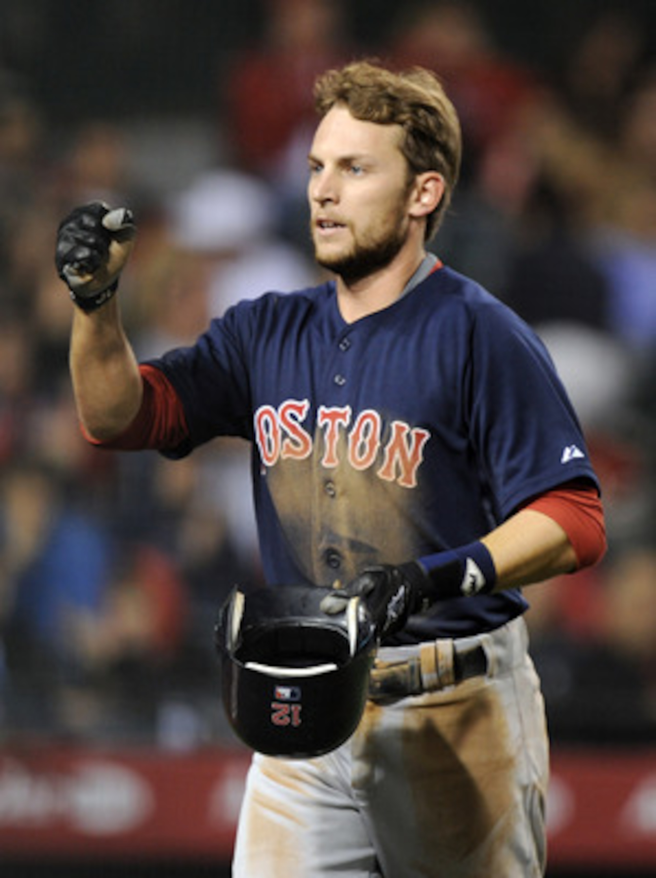 ANAHEIM, CA - APRIL 22:  Jed Lowrie #12 of the Boston Red Sox celebrates his run for a 4-0 lead over the Los Angeles Angels of Anaheim during the fifth inning at Angel Stadium on April 22, 2011 in Anaheim, California.  (Photo by Harry How/Getty Images)
