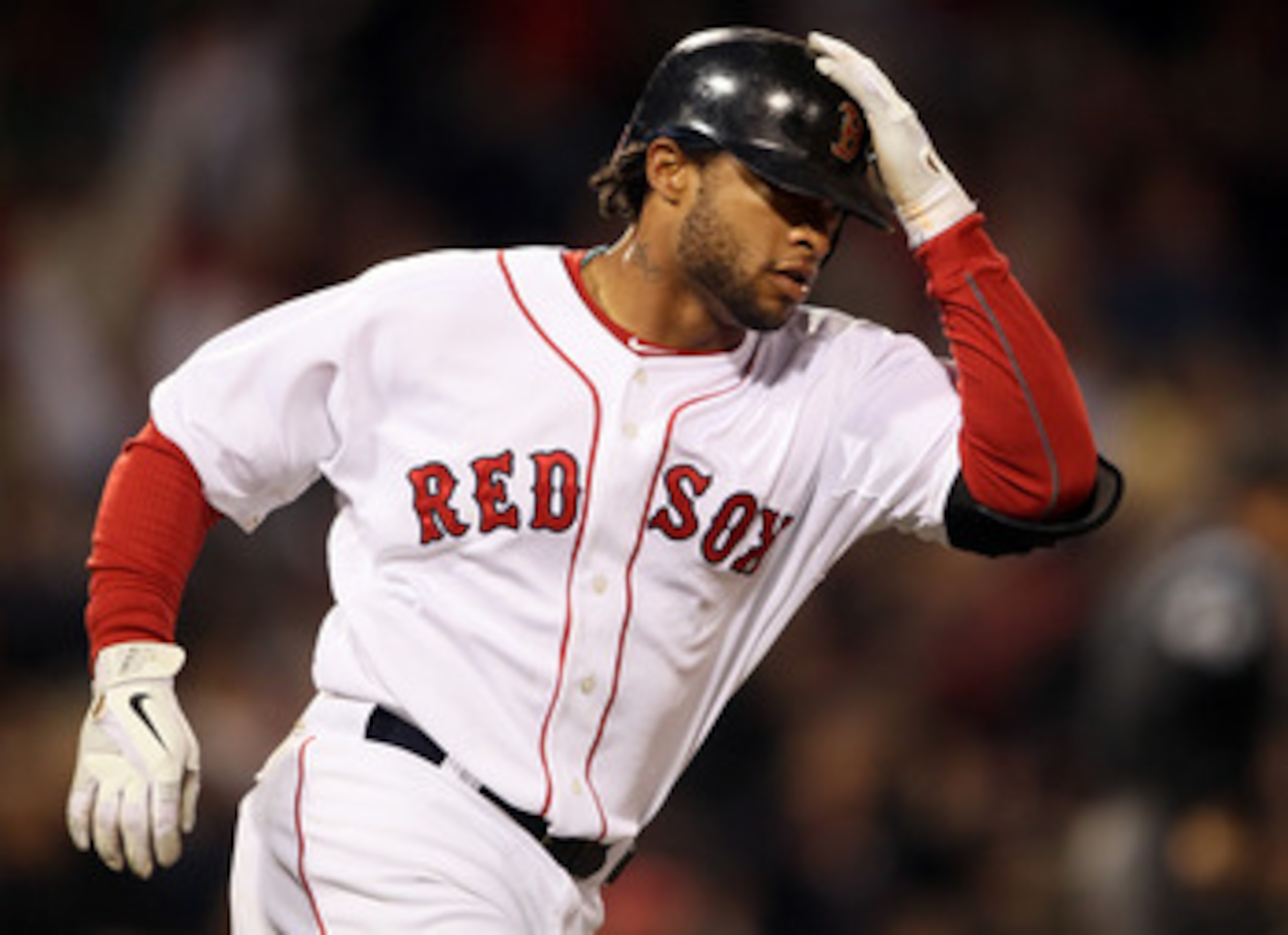 BOSTON, MA - APRIL 12:  Darnell McDonald #54 of the Boston Red Sox rounds the bases after he hits a a solo home run in the third inning against the Tampa Bay Rays on April 12, 2011 at Fenway Park in Boston, Massachusetts.  (Photo by Elsa/Getty Images)