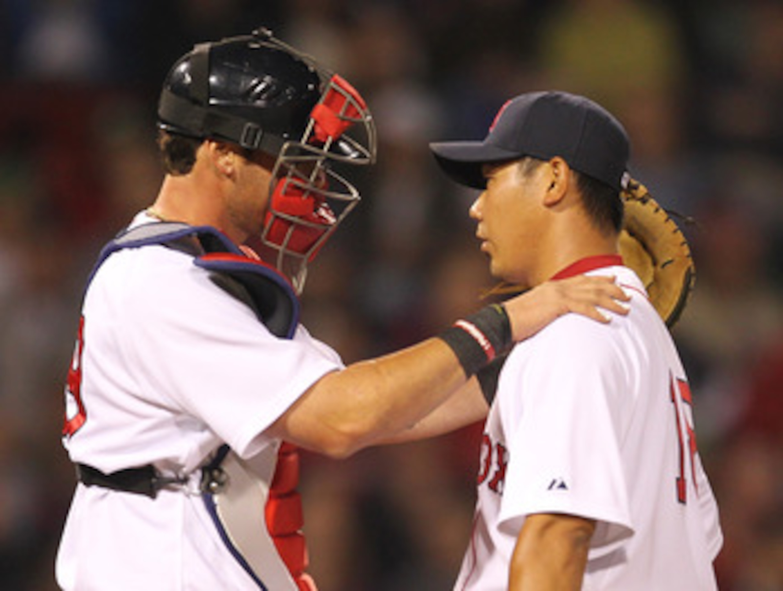 BOSTON, MA - APRIL 11:  Jarrod Saltalamacchia #39 consoles Daisuke Matsuzaka #18 of the Boston Red Sox after a six-run second inning against the Tampa Bay Rays at Fenway Park April 11, 2011 in Boston, Massachusetts. (Photo by Jim Rogash/Getty Images)