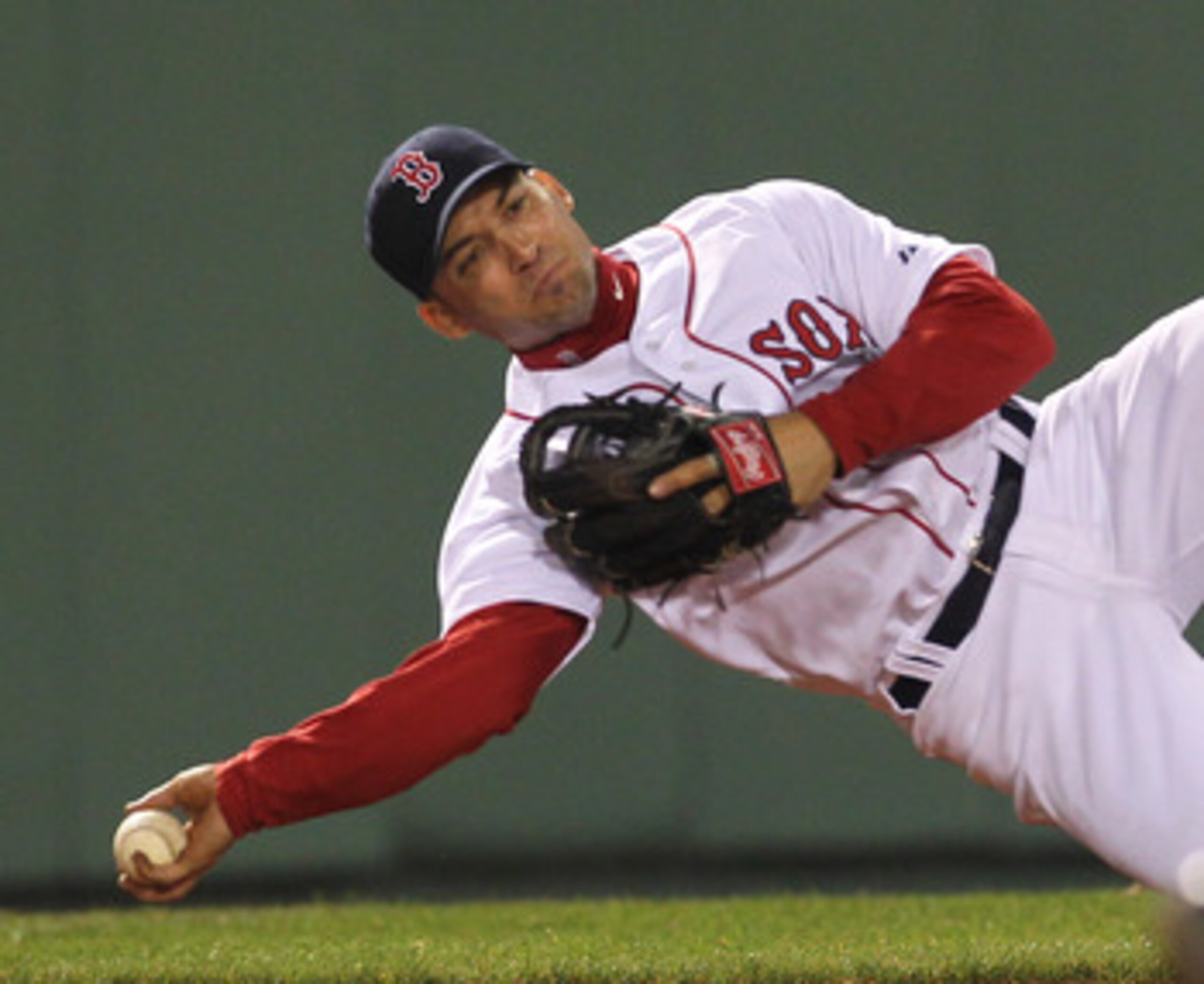 BOSTON, MA - APRIL 11:  Marco Scutaro #10 of the Boston Red Sox is unable to make the assist against the Tampa Bay Rays at Fenway Park April 11, 2011 in Boston, Massachusetts. (Photo by Jim Rogash/Getty Images)