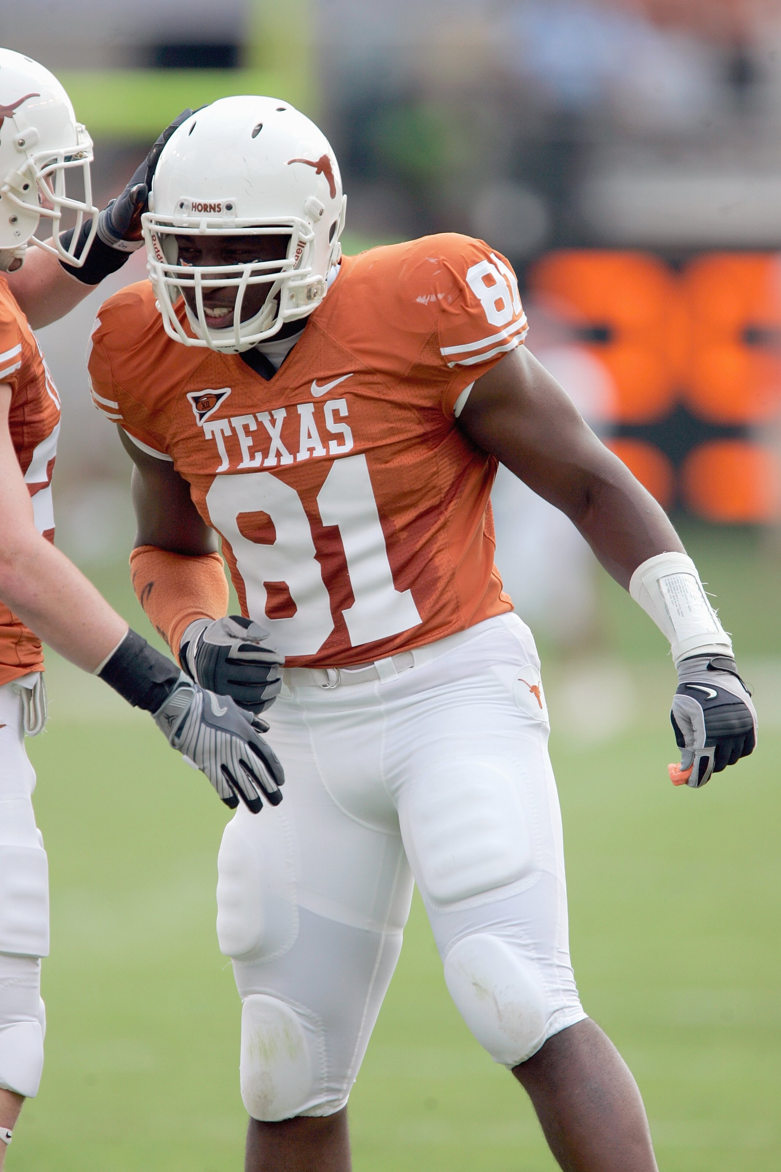AUSTIN, TX - SEPTEMBER 27:  Sam Acho #81 of the Texas Longhorns is congratulated during the game against the Arkansas Razorbacks on September 27, 2008 at Darrell K Royal-Texas Memorial Stadium in Austin, Texas.  Texas won 52-10.  (Photo by Brian Bahr/Gett