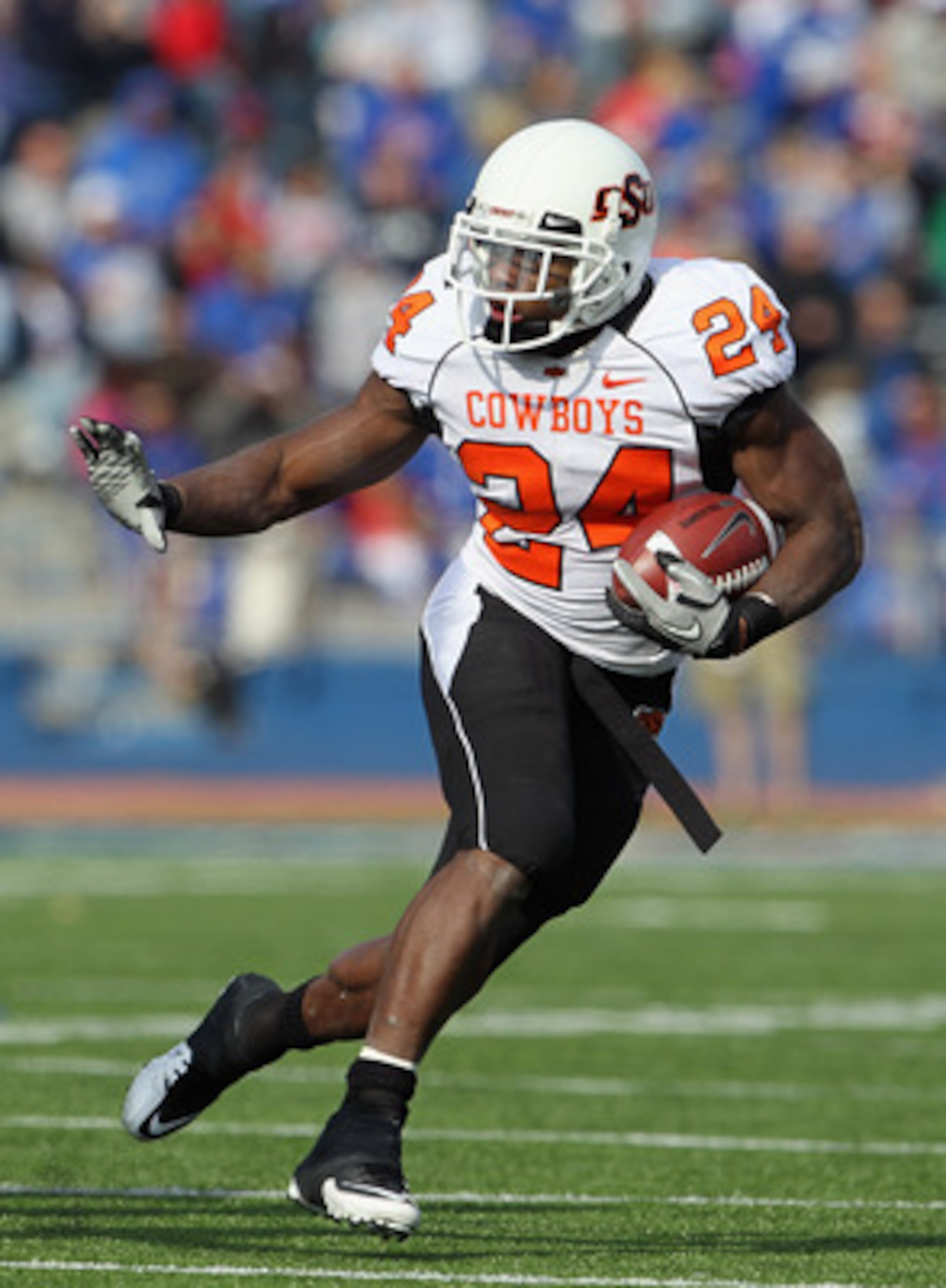 LAWRENCE, KS - NOVEMBER 20:  Running back Kendall Hunter #24 of the Oklahoma State Cowboys carries the ball during the game against the Kansas Jayhawks on November 20, 2010 at Memorial Stadium in Lawrence, Kansas.  (Photo by Jamie Squire/Getty Images)