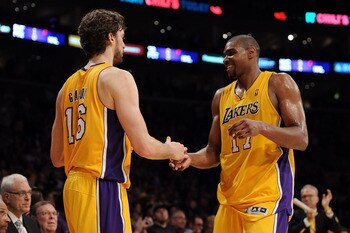 LOS ANGELES, CA - APRIL 20:  Pau Gasol #16 and Andrew Bynum #17 of the Los Angeles Lakers celebrate as Bynum comes to the bench while taking on the New Orleans Hornets in Game Two of the Western Conference Quarterfinals in the 2011 NBA Playoffs on April 2
