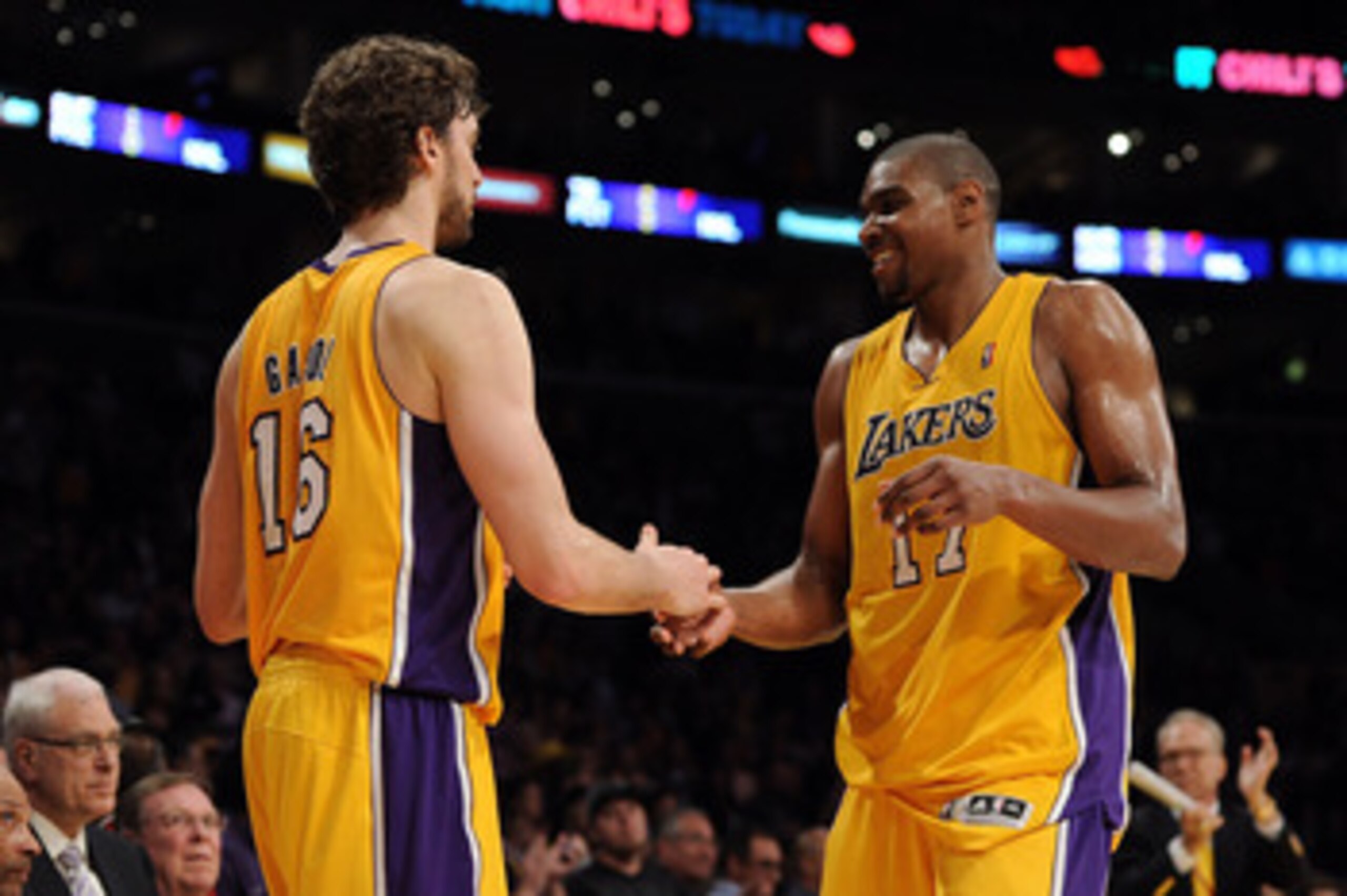 LOS ANGELES, CA - APRIL 20:  Pau Gasol #16 and Andrew Bynum #17 of the Los Angeles Lakers celebrate as Bynum comes to the bench while taking on the New Orleans Hornets in Game Two of the Western Conference Quarterfinals in the 2011 NBA Playoffs on April 2