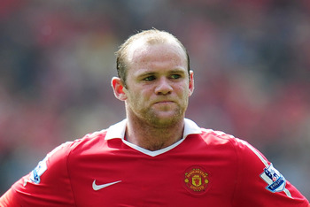 MANCHESTER, ENGLAND - APRIL 23:  Wayne Rooney of Manchester United looks dejected during the Barclays Premier League match between Manchester United and Everton at Old Trafford on April 23, 2011 in Manchester, England.  (Photo by Shaun Botterill/Getty Ima