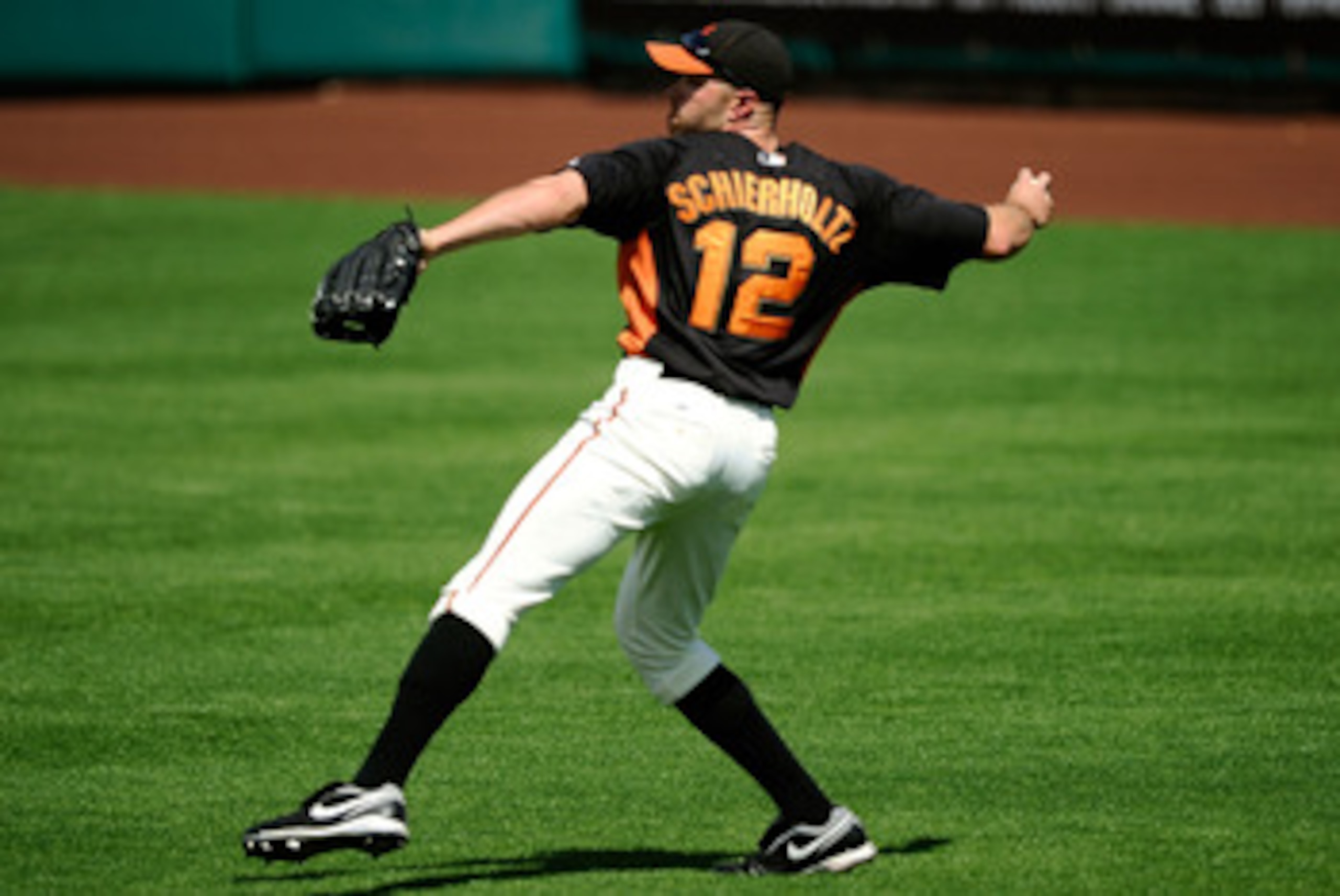 SCOTTSDALE, AZ - MARCH 18: Nate Schierholtz #12 of the San Francisco Giants plays against during the spring training baseball game against the Los Angeles Dodgers at Scottsdale Stadium on March 18, 2011 in Scottsdale, Arizona. (Photo by Kevork Djansezia SCOTTSDALE, AZ - MARCH 18: Nate Schierholtz #12 of the San Francisco Giants plays against during the spring training baseball game against the Los Angeles Dodgers at Scottsdale Stadium on March 18, 2011 in Scottsdale, Arizona. (Photo by Kevork Djansezia