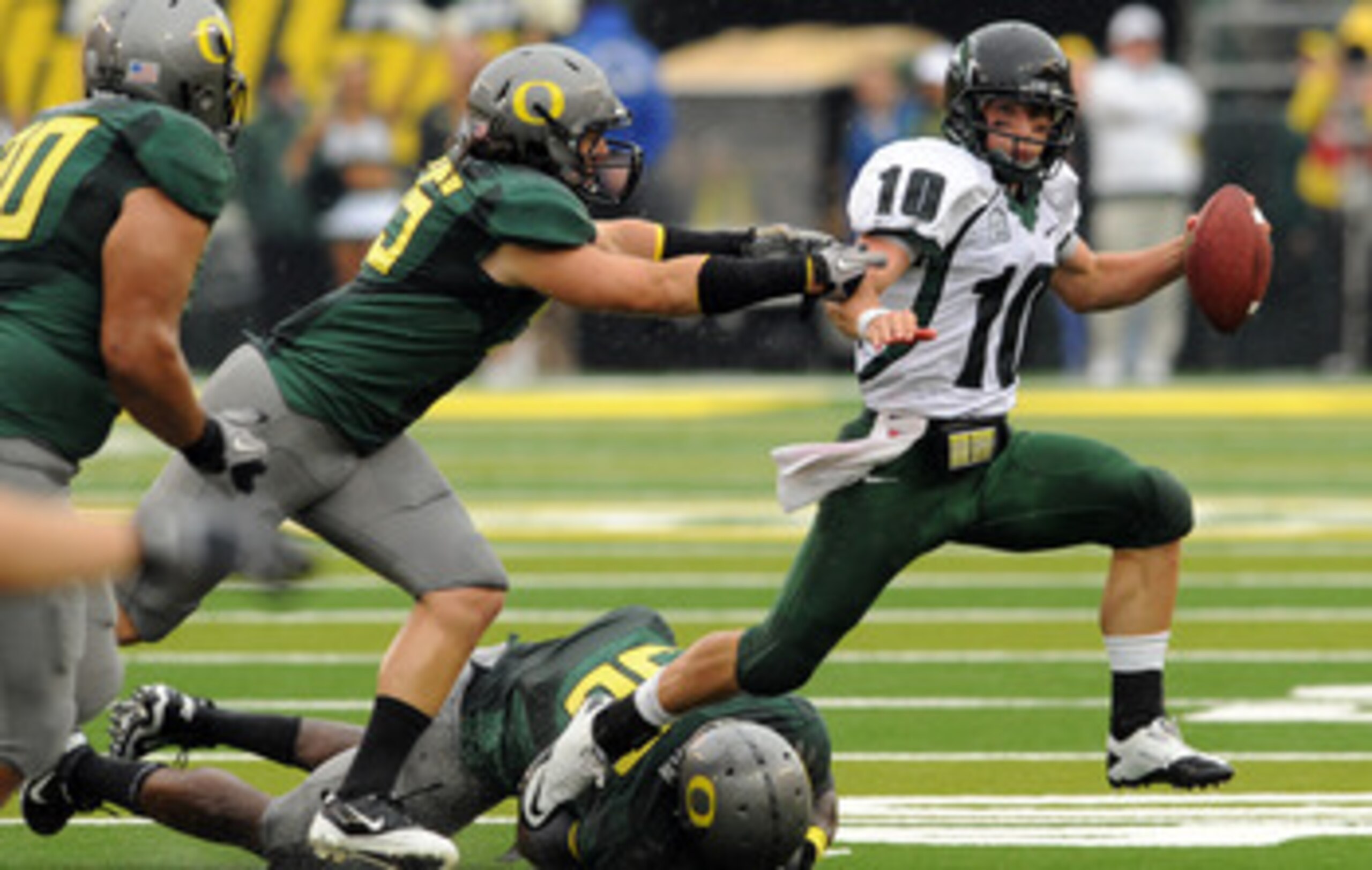EUGENE, OR - SEPTEMBER 18: Quarterback Connor Kavanaugh #10 of the Portland State sacked by linebacker Casey Matthews #55 of the Oregon Ducks in the second quarter of the game at Autzen Stadium on September 18, 2010 in Eugene, Oregon.  (Photo by Steve Dyk