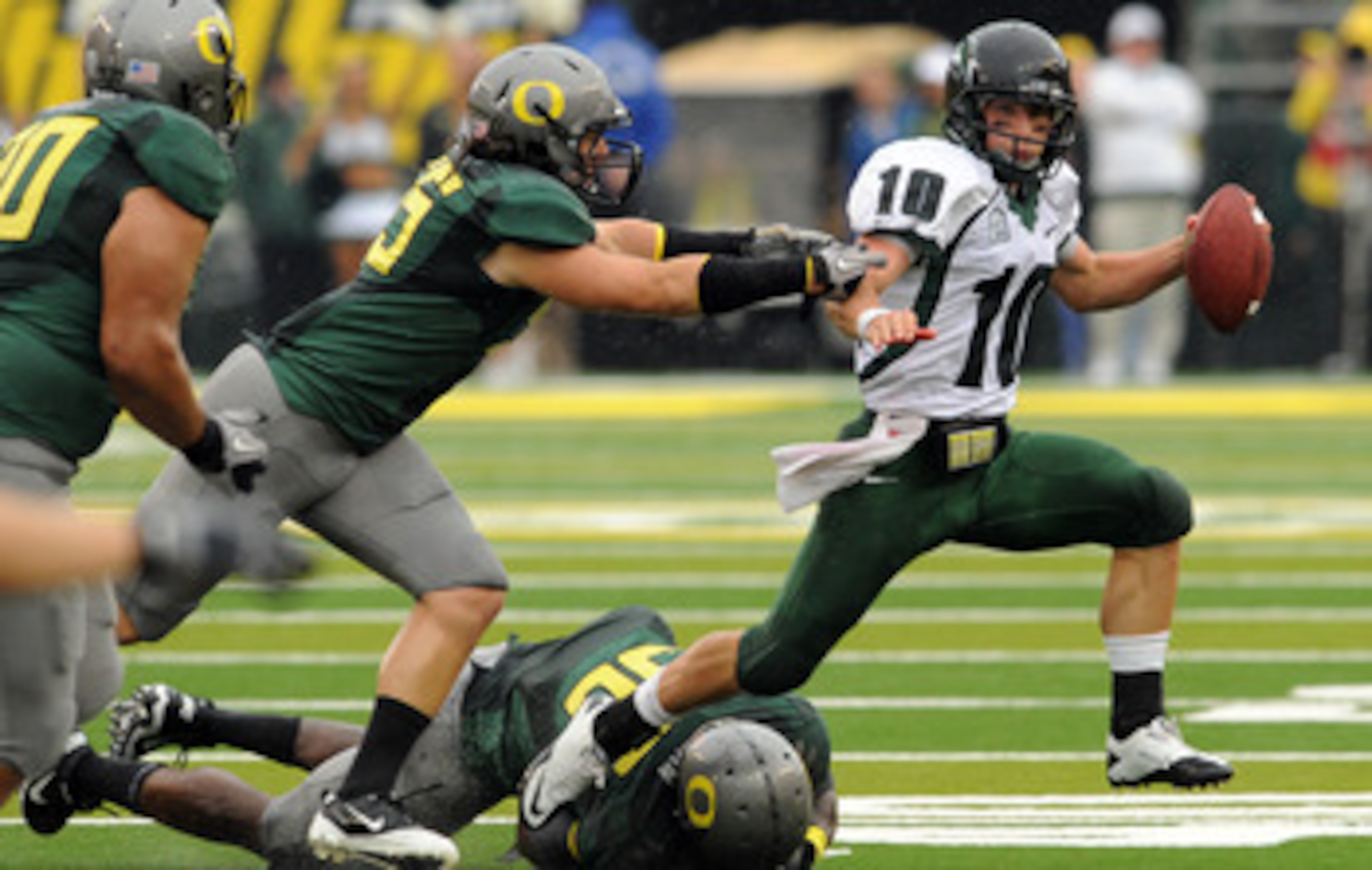 EUGENE, OR - SEPTEMBER 18: Quarterback Connor Kavanaugh #10 of the Portland State sacked by linebacker Casey Matthews #55 of the Oregon Ducks in the second quarter of the game at Autzen Stadium on September 18, 2010 in Eugene, Oregon.  (Photo by Steve Dyk