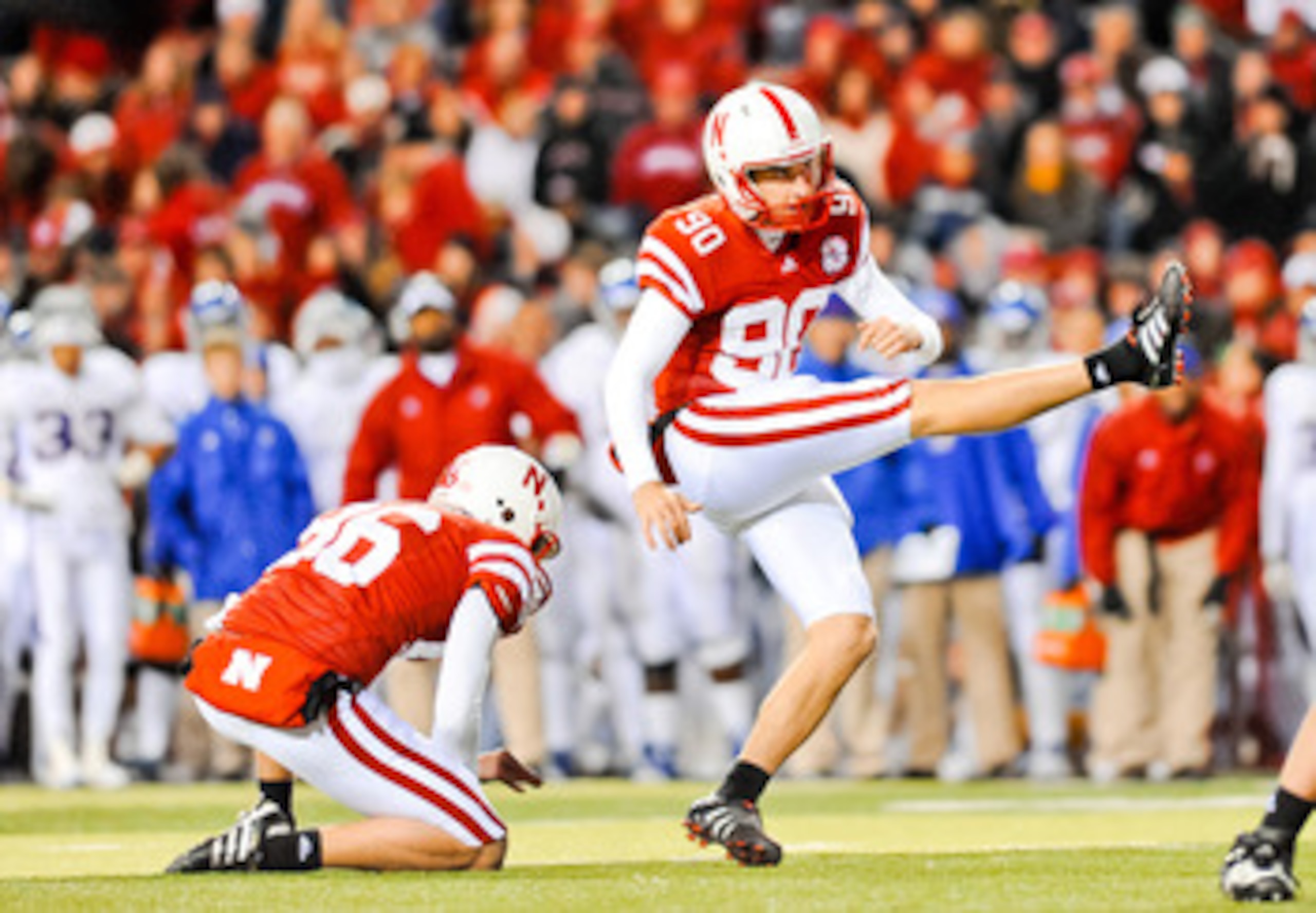 LINCOLN, NE - NOVEMBER 13: Alex Henery #90 of the Nebraska Cornhuskers kicks an extra point against the Kansas Jayhawks during their game at Memorial Stadium on November 13, 2010 in Lincoln, Nebraska. Nebraska Defeated Kansas 20-3. (Photo by Eric Francis/