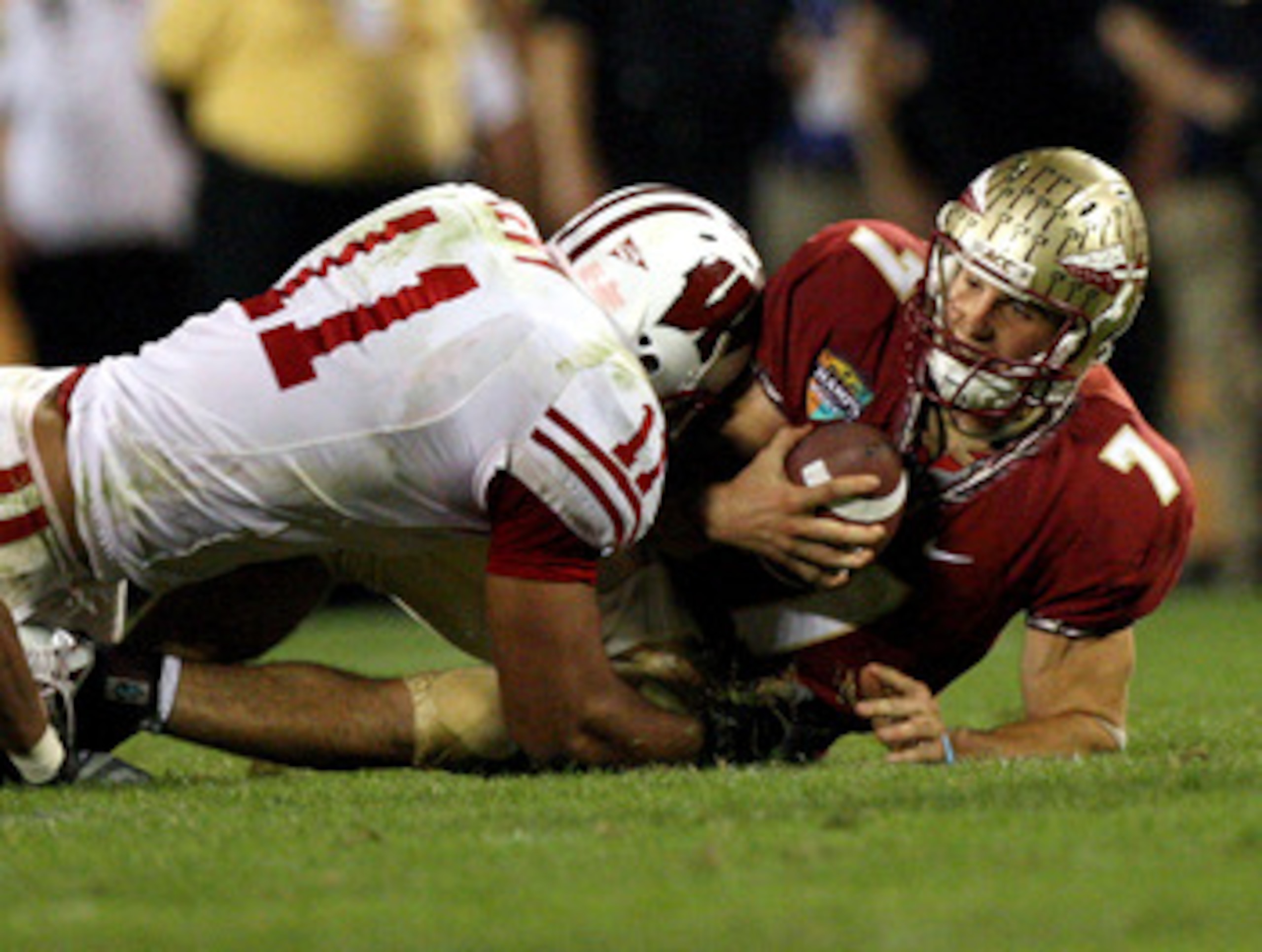ORLANDO, FL - DECEMBER 27:  Quarterback Christian Ponder #7 of the Florida State Seminoles is sacked by DeAndre Levy #11 of the Wisconsin Badgers during the Champs Bowl on December 27, 2008 at the Citrus Bowl in Orlando, Florida.  (Photo by Sam Greenwood/