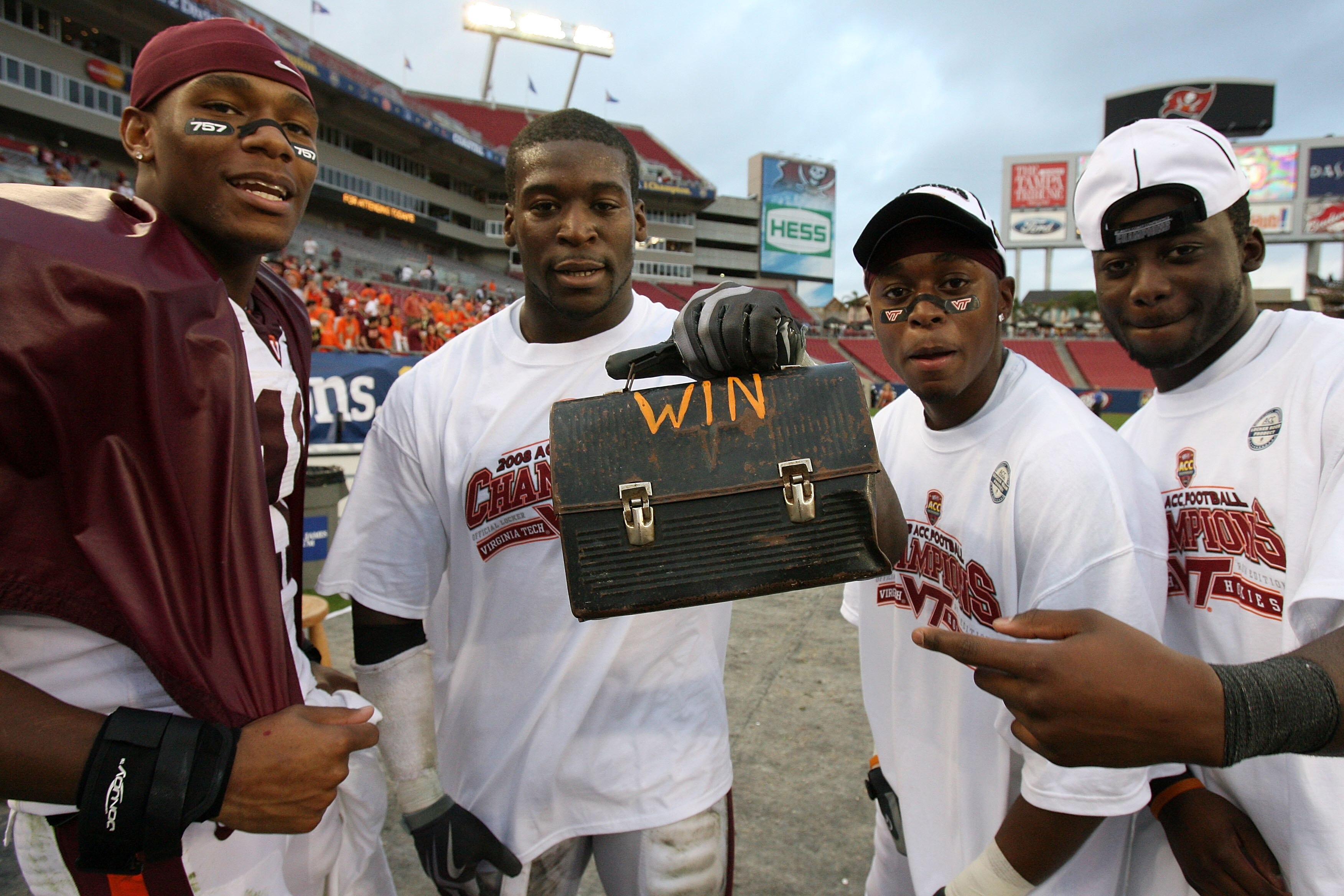 TAMPA, FL - DECEMBER 06:  Defensive end Jason Worilds #6 of the Virginia Tech Hokies holds up the the lunch pale, that signifies the team's hard work ethic, after defeating the Boston College Eagles in the 2008 ACC Football Championship game at the Raymon