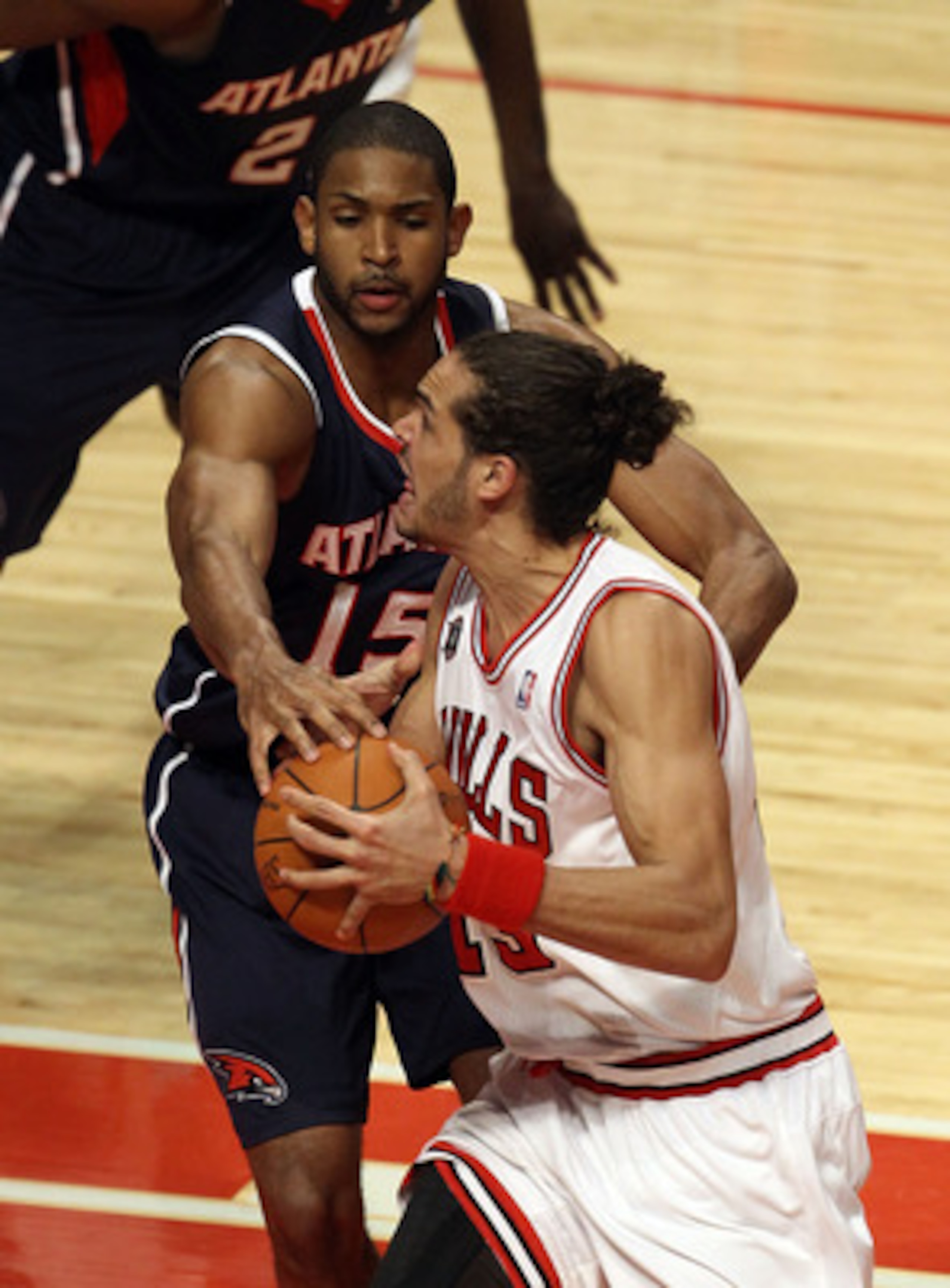 CHICAGO, IL - MARCH 11: Joakim Noah #13 of the Chicago Bulls drives against Al Horford #15 of the Atlanta Hawks at the United Center on March 11, 2011 in Chicago, Illinois. The Bulls defeated the Hawks 94-76. NOTE TO USER: User expressly acknowledges and