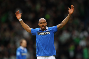 GLASGOW, SCOTLAND - MARCH 20:  El Hadji Diouf of Rangers celebrates winning over Celtic during the Co-operative Insurance Cup final between at Hampden Park on March 20, 2011 in Glasgow, Scotland.  (Photo by Julian Finney/Getty Images)