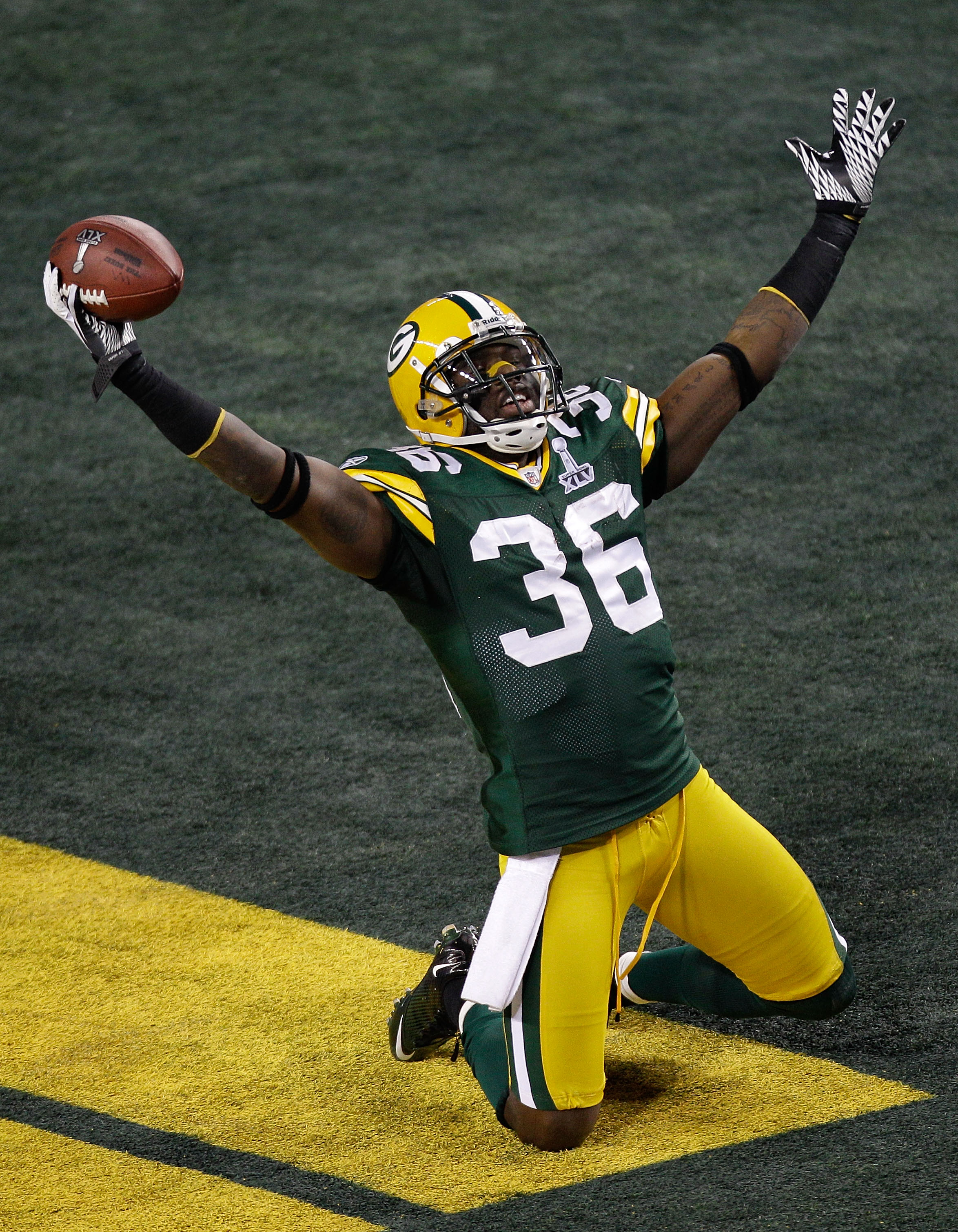 ARLINGTON, TX - FEBRUARY 06:  Nick Collins #36 of the Green Bay Packers celebrates after scoring a 37 yard touchdown on an interception in the first quarter against the Pittsburgh Steelers during Super Bowl XLV at Cowboys Stadium on February 6, 2011 in Ar