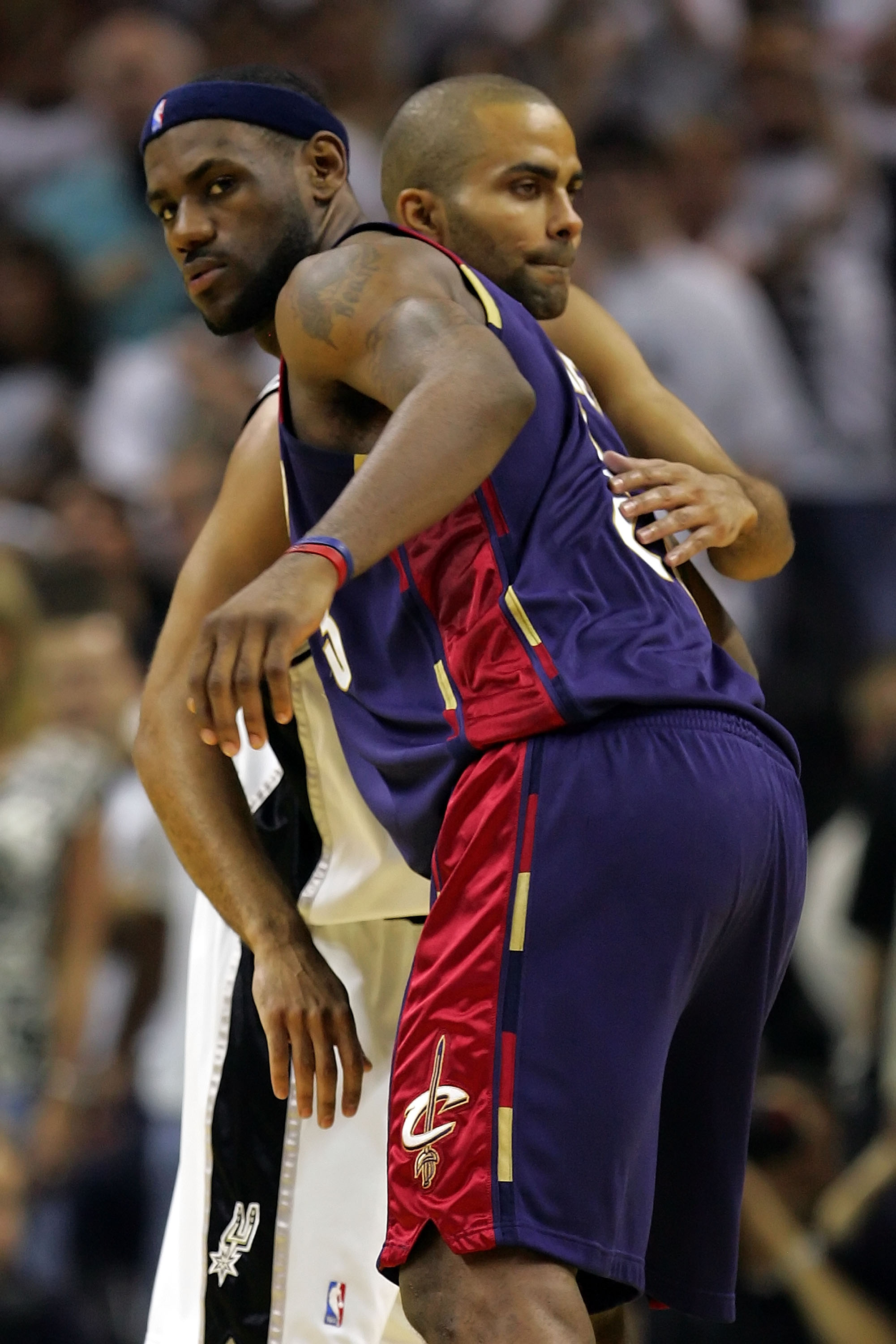 SAN ANTONIO - JUNE 07:  LeBron James #23 of the Cleveland Cavaliers looks back as he hugs Tony Parker #9 of the San Antonio Spurs before Game One of the 2007 NBA Finals on June 7, 2007 at the AT&T Center in San Antonio, Texas.  NOTE TO USER: User expressl