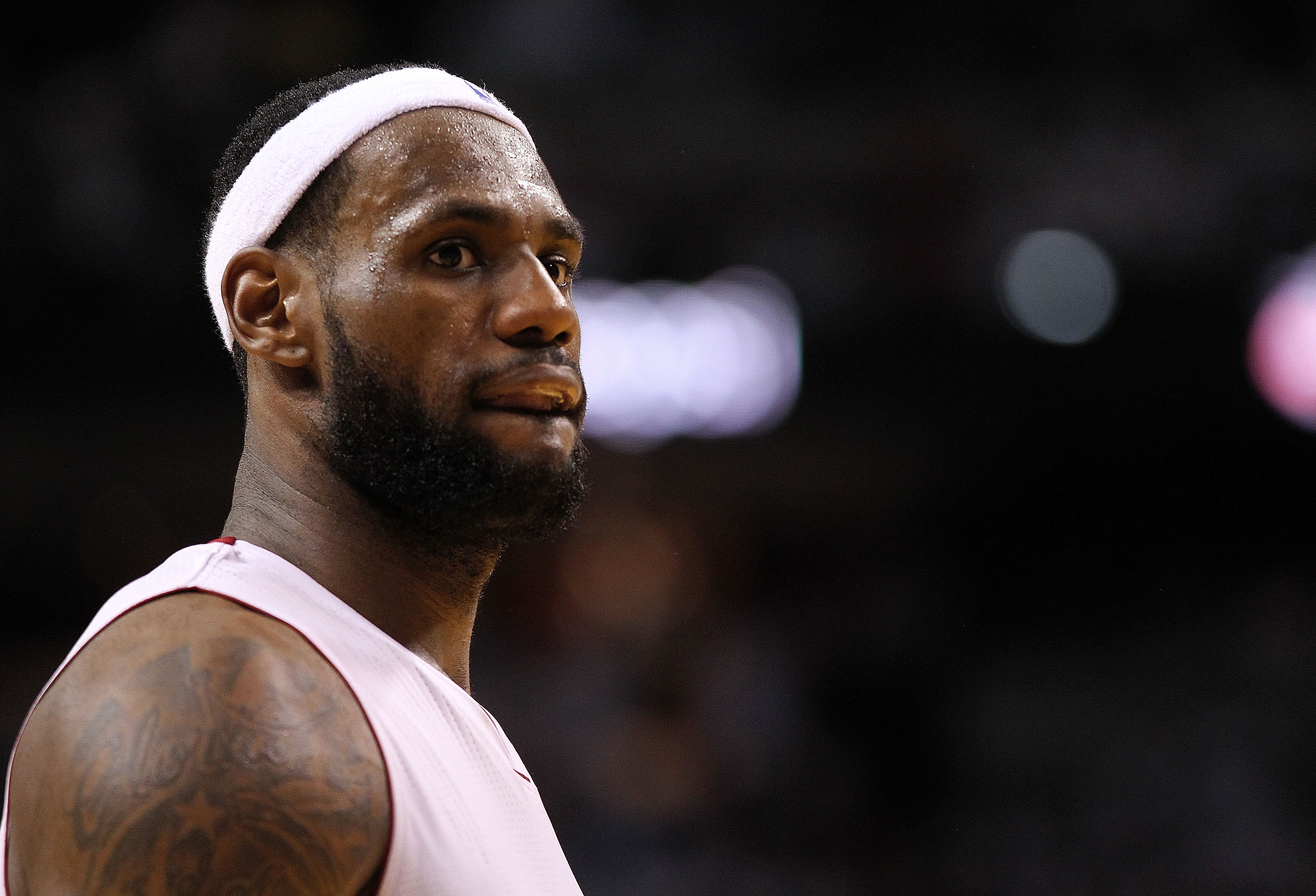 MIAMI, FL - APRIL 27:   LeBron James #6 of the Miami Heat looks on during game five of the Eastern Conference Quarterfinals in the 2011 NBA Playoffs against the Philadelphia 76ers at American Airlines Arena on April 27, 2011 in Miami, Florida. NOTE TO USE