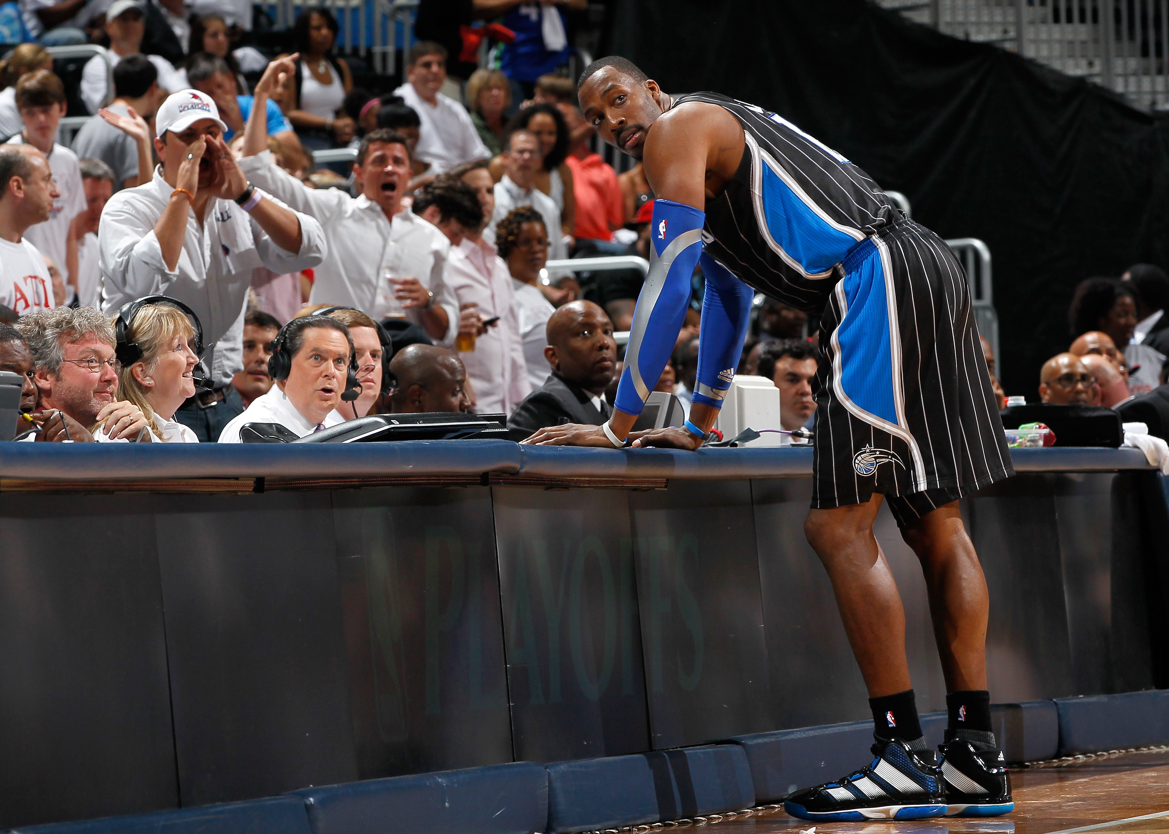 ATLANTA, GA - APRIL 28:  Dwight Howard #12 of the Orlando Magic stands at the scorer's table after being earning a technical foul against Zaza Pachulia #27 of the Atlanta Hawks during Game Six of the Eastern Conference Quarterfinals in the 2011 NBA Playof