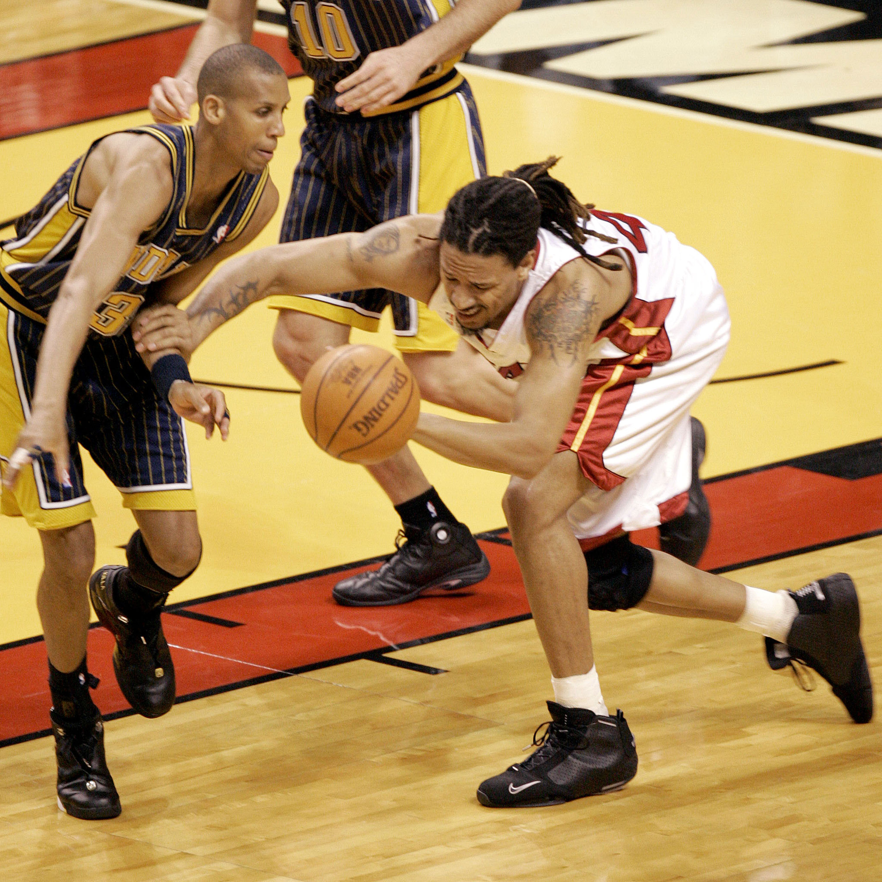 MIAMI - MAY 12:  Reggie Miller #31 of the Indiana Pacers and Brian Grant #44 of the Miami Heat go for a loose ball in the first quarter in Game Four of the Eastern Conference Semifinals during the 2004 NBA Playoffs May 12, 2004 at the American Airlines Ar