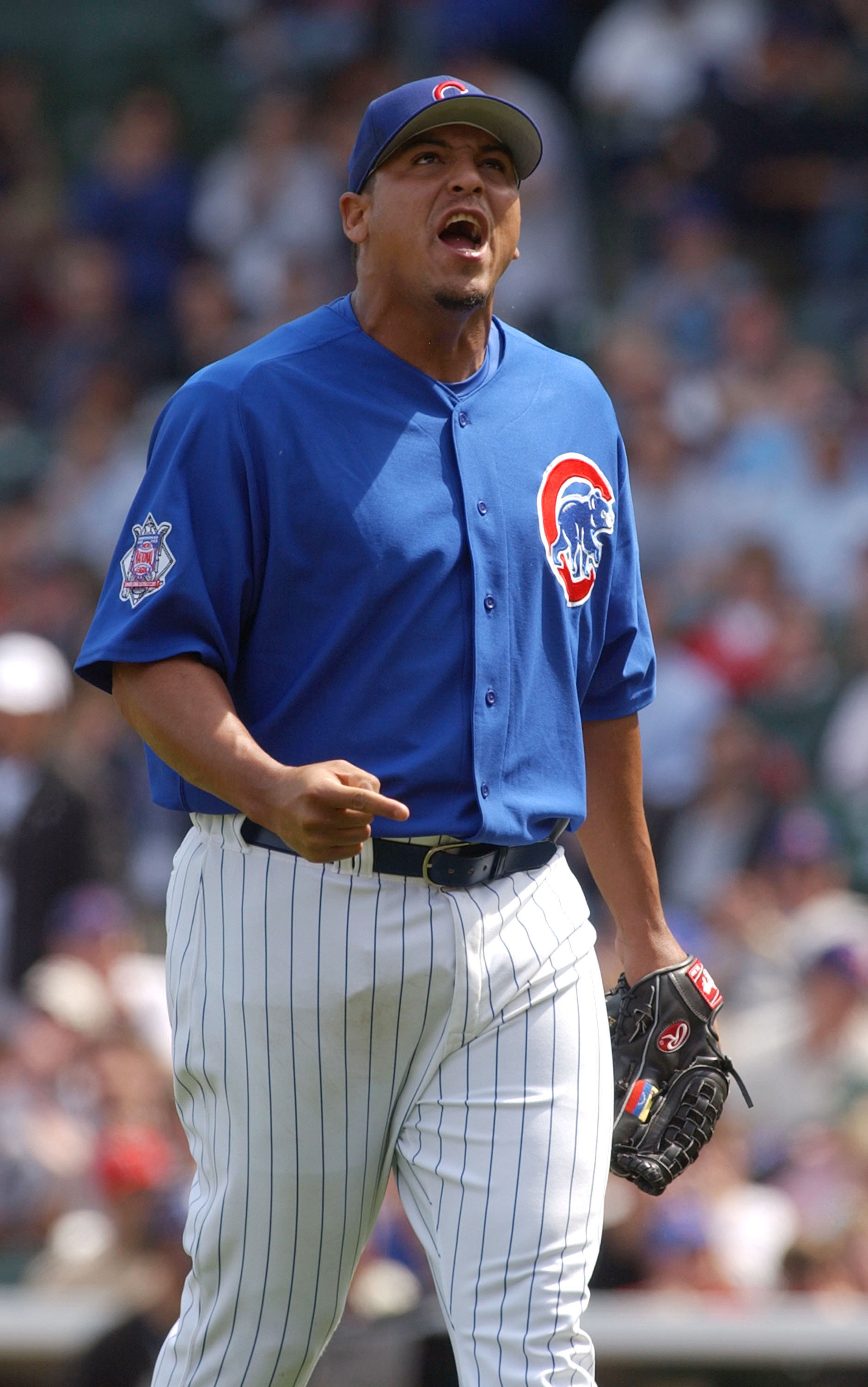 CHICAGO - APRIL 15:  Starting pitcher Carlos Zambrano #38 of the Chicago Cubs yells in celebration after striking out Craig Wilson of the Pittsburgh Pirates to end the first inning April 15, 2004 at Wrigley Field in Chicago, Illinois. The Cubs defeated th