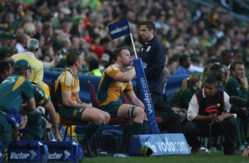 CAPE TOWN, SOUTH AFRICA - AUGUST 08:  Matt Giteau (L) and Richard Brown of the Wallabies sit on the sin bin bench during the Tri Nations match between the South Africa Springboks and the Australia Wallabies at Newlands Stadium on August 8, 2009 in Cape To