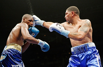 LAS VEGAS - APRIL 11:  Winky Wright (R) hits Paul Williams in the sixth round of their middleweight bout at the Mandalay Bay Events Center April 11, 2009 in Las Vegas, Nevada. Williams won by unanimous decision.  (Photo by Ethan Miller/Getty Images)