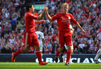 LIVERPOOL, ENGLAND - MAY 01:  Dirk Kuyt of Liverpool celebrates with team mate Luis Suarez after scoring the second goal from the penalty spot during the Barclays Premier League match between Liverpool  and Newcastle United at Anfield on May 1, 2011 in Li