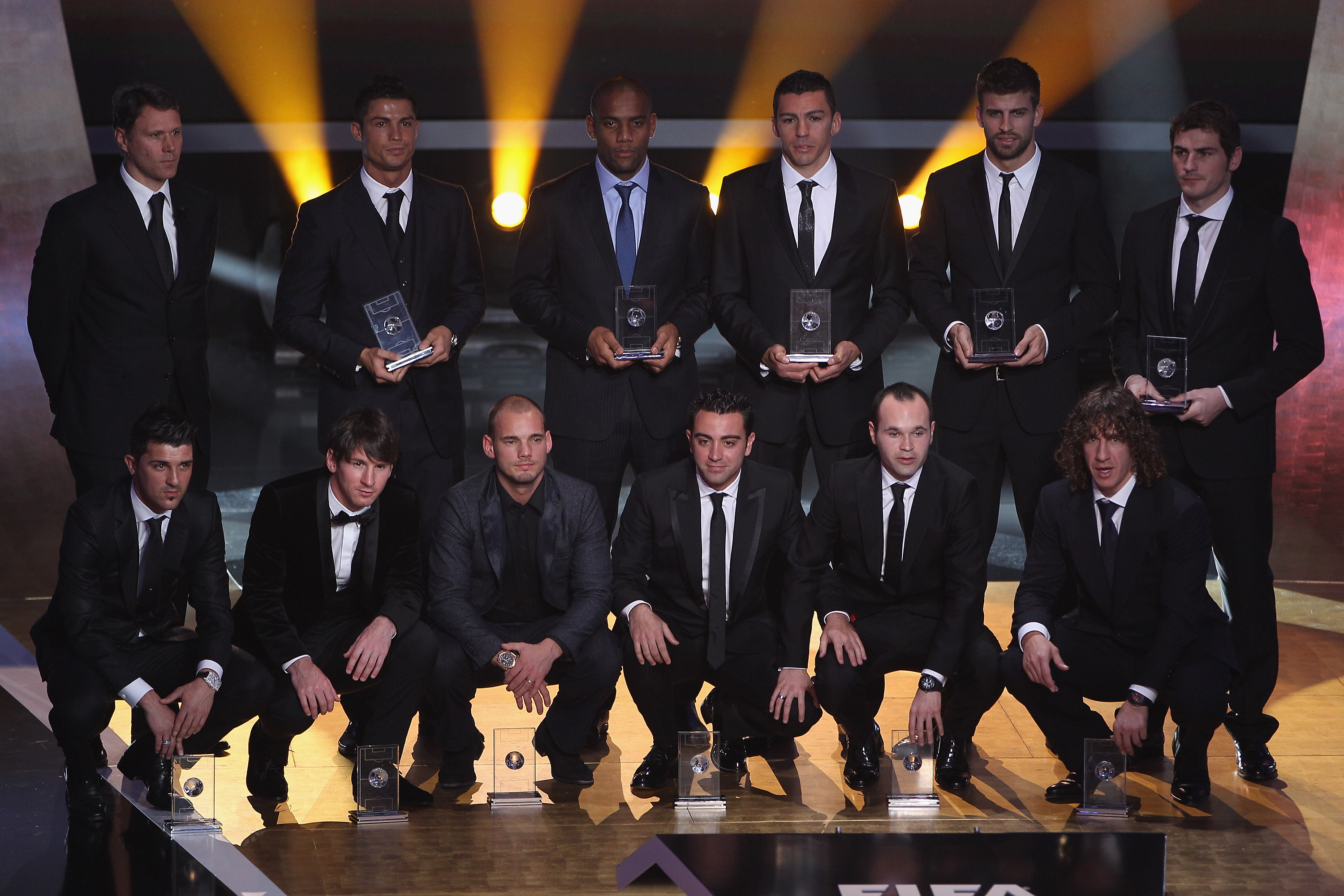 ZURICH, SWITZERLAND - JANUARY 10:  Fifa World XI award players back row l to r: Marco Van Basten who presented the award,Ronaldo,Maicon,Lucio,Gerard Pique,Iker Casillas, front row l to r: David Villa,Lionel Messi,Wesley Sneijder,Xavi,Andres Iniesta,Puyol