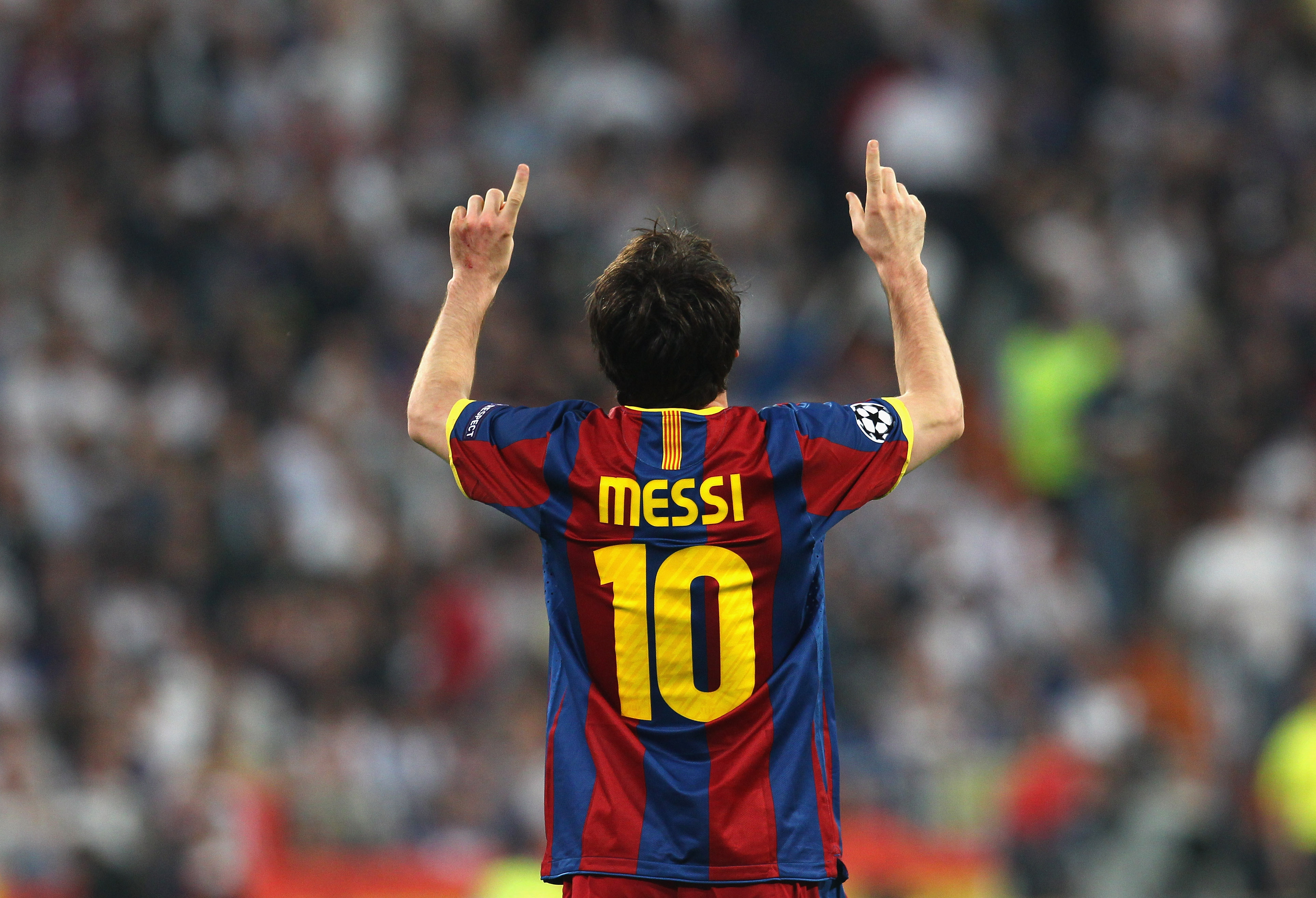 MADRID, SPAIN - APRIL 27:  Lionel Messi of Barcelona celebrates after scoring his second goal during the UEFA Champions League Semi Final first leg match between Real Madrid and Barcelona at Estadio Santiago Bernabeu on April 27, 2011 in Madrid, Spain.  (