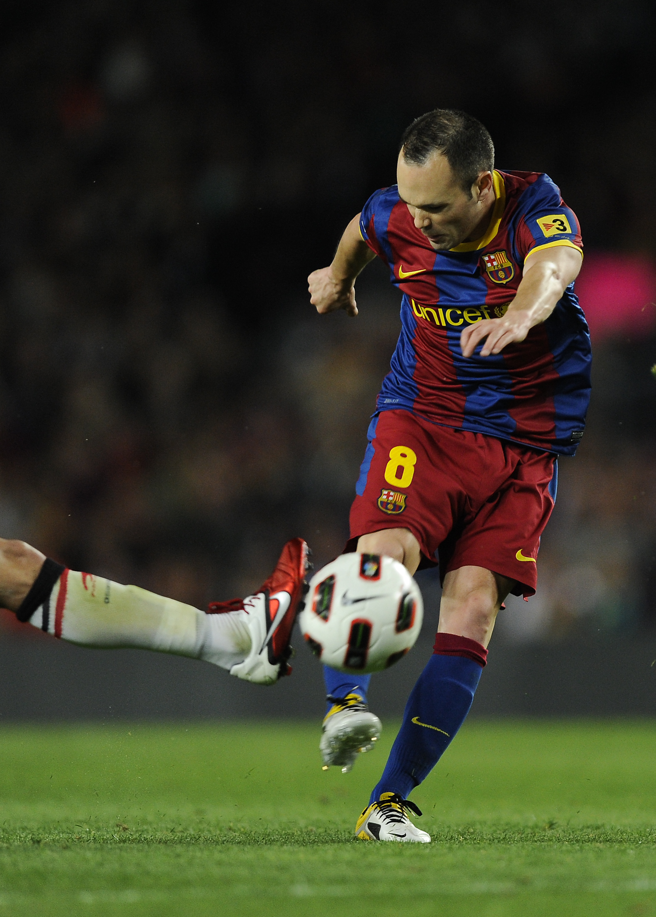 BARCELONA, SPAIN - APRIL 23:  Andres Iniesta of FC Barcelona (C) shoots towards goal during the La Liga match between Barcelona and CA Osasuna at Camp Nou Stadium on April 23, 2011 in Barcelona, Spain. Barcelona won 2-0.  (Photo by David Ramos/Getty Image