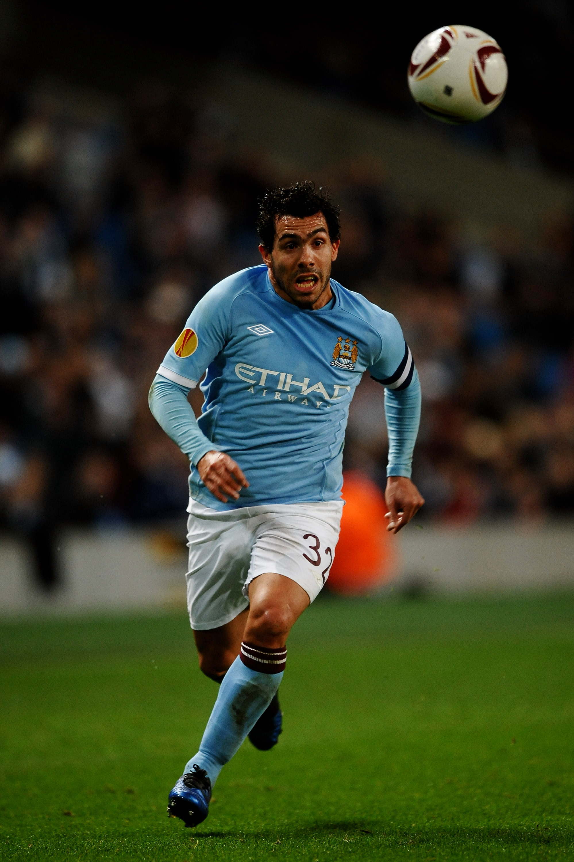 MANCHESTER, ENGLAND - MARCH 17:  Carlos Tevez of Manchester City runs with the ball during the UEFA Europa League round of 16 second leg match between Manchester City and Dynamo Kiev at City of Manchester Stadium on March 17, 2011 in Manchester, England.