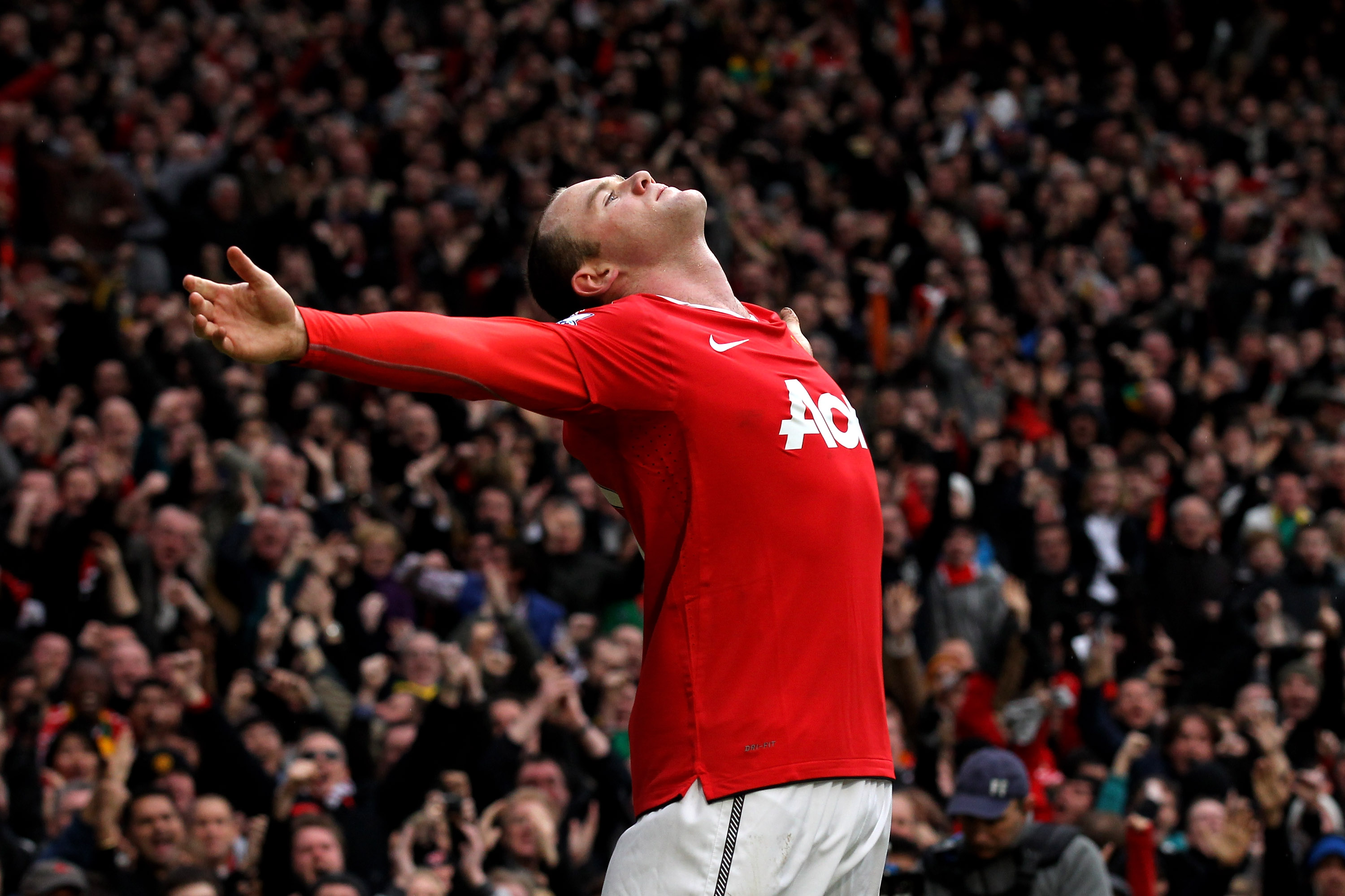 MANCHESTER, ENGLAND - FEBRUARY 12:  Wayne Rooney of Manchester United celebrates after he scores a goal from an overhead kick during the Barclays Premier League match between Manchester United and Manchester City at Old Trafford on February 12, 2011 in Ma