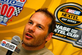 Jacques Villenueve speaks to the press at a NASCAR press conference.