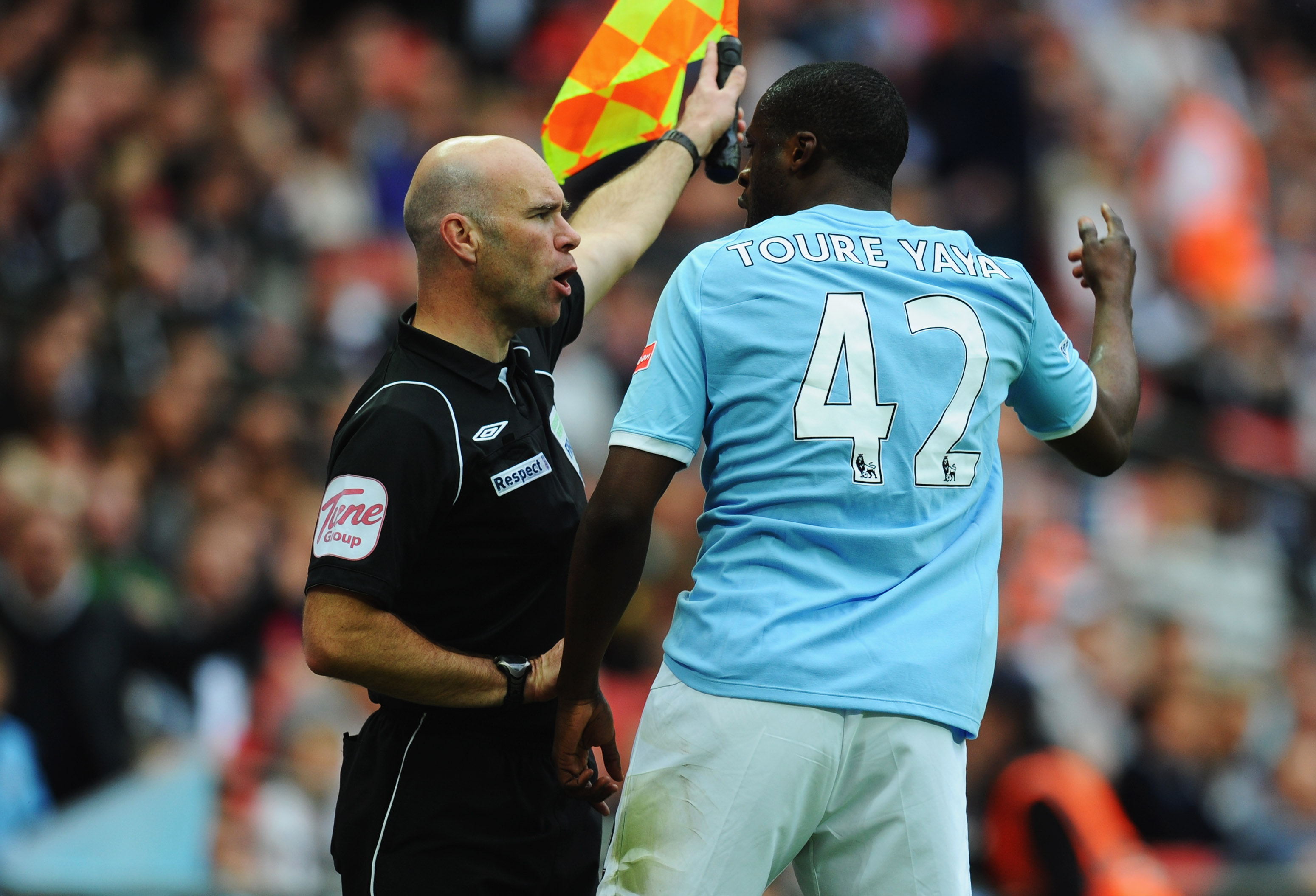LONDON, ENGLAND - APRIL 16:  Yaya Toure of Manchester City argues with the assistant referee during the FA Cup sponsored by E.ON semi final match between Manchester City and Manchester United at Wembley Stadium on April 16, 2011 in London, England.  (Phot