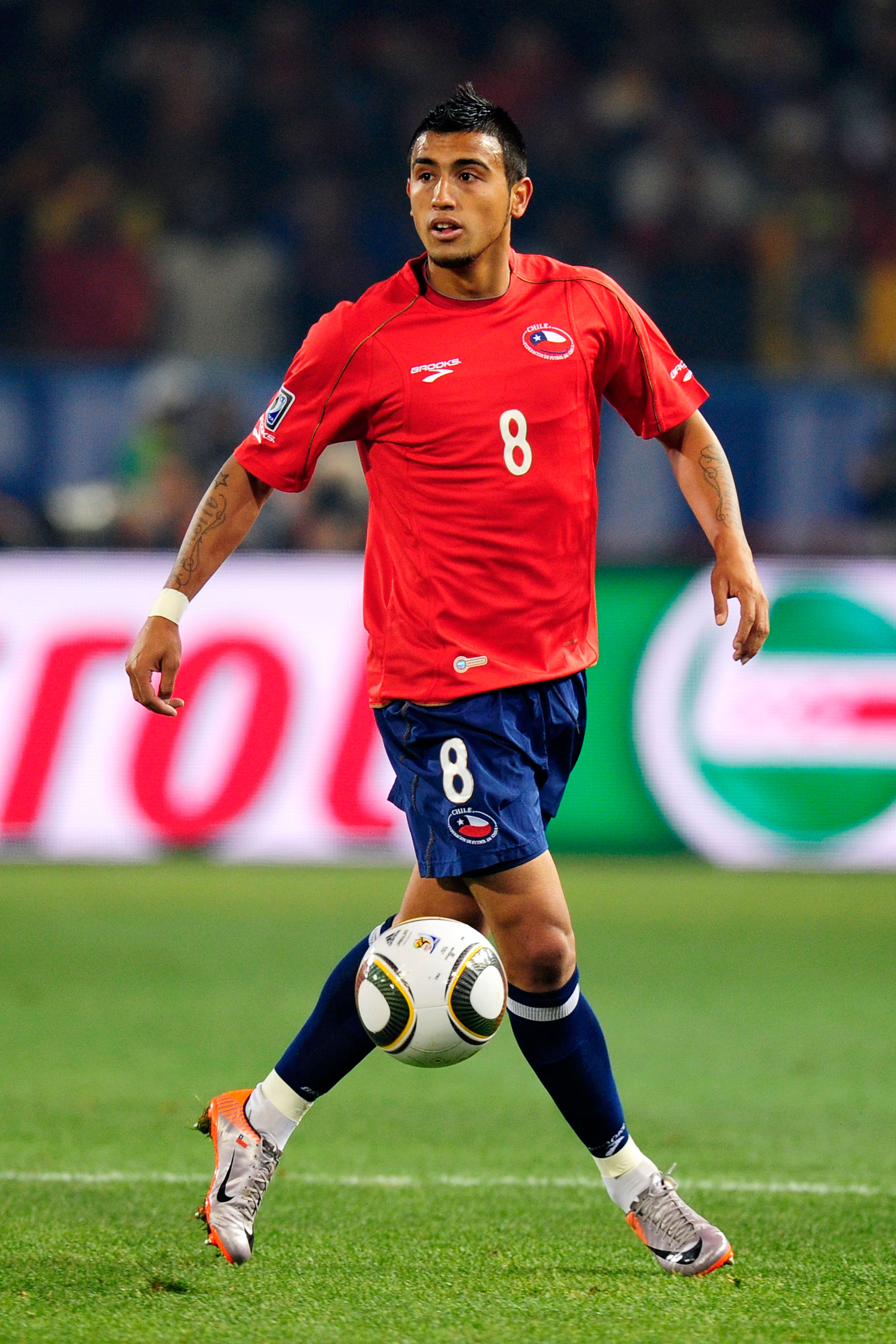 PRETORIA, SOUTH AFRICA - JUNE 25: Arturo Vidal of Chile in action during the 2010 FIFA World Cup South Africa Group H match between Chile and Spain at Loftus Versfeld Stadium on June 25, 2010 in Tshwane/Pretoria, South Africa.  (Photo by Stuart Franklin/G