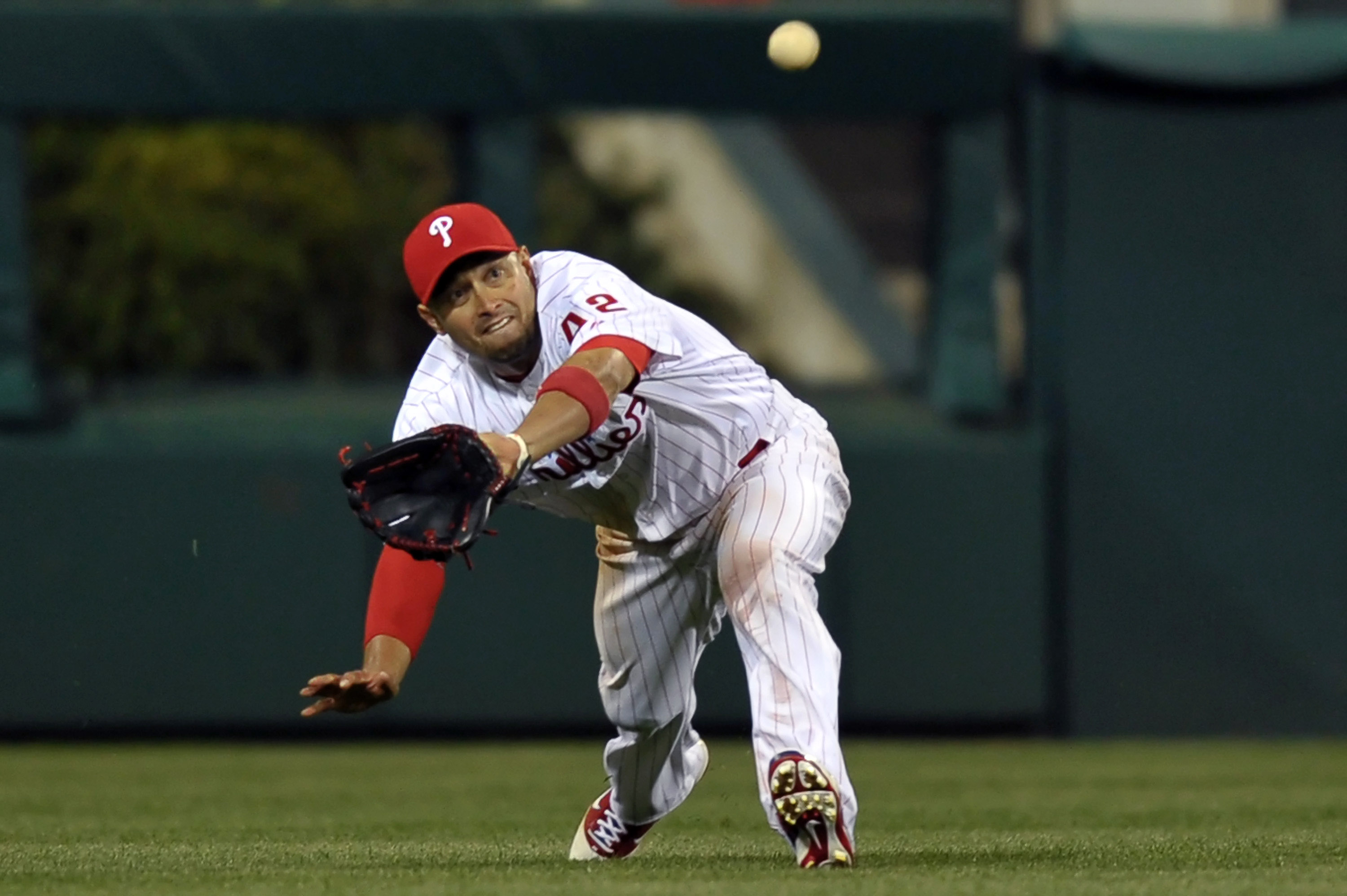 PHILADELPHIA, PA - APRIL 15: Shane Victorino #8 of the Philadelphia Phillies catches a fly ball during the game against the Florida Marlins at Citizens Bank Park on April 15, 2011 in Philadelphia, Pennsylvania. The Marlins won 4-3. (Photo by Drew Hallowel